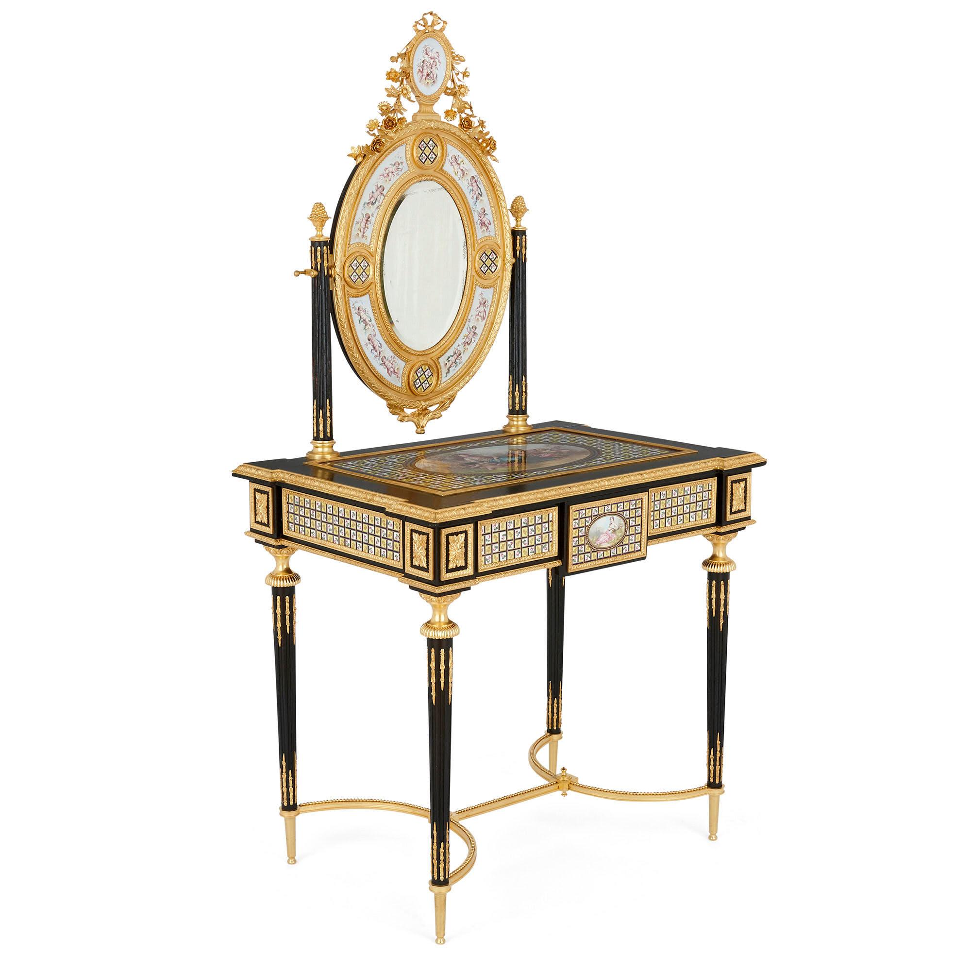 Crafted from sumptuous materials, this porcelain, gilt bronze, and ebonised wood dressing table is an exceptional piece of 19th century French design.

The table features an ebonised wood top, mounted to the edge with gilt bronze, and inset with a