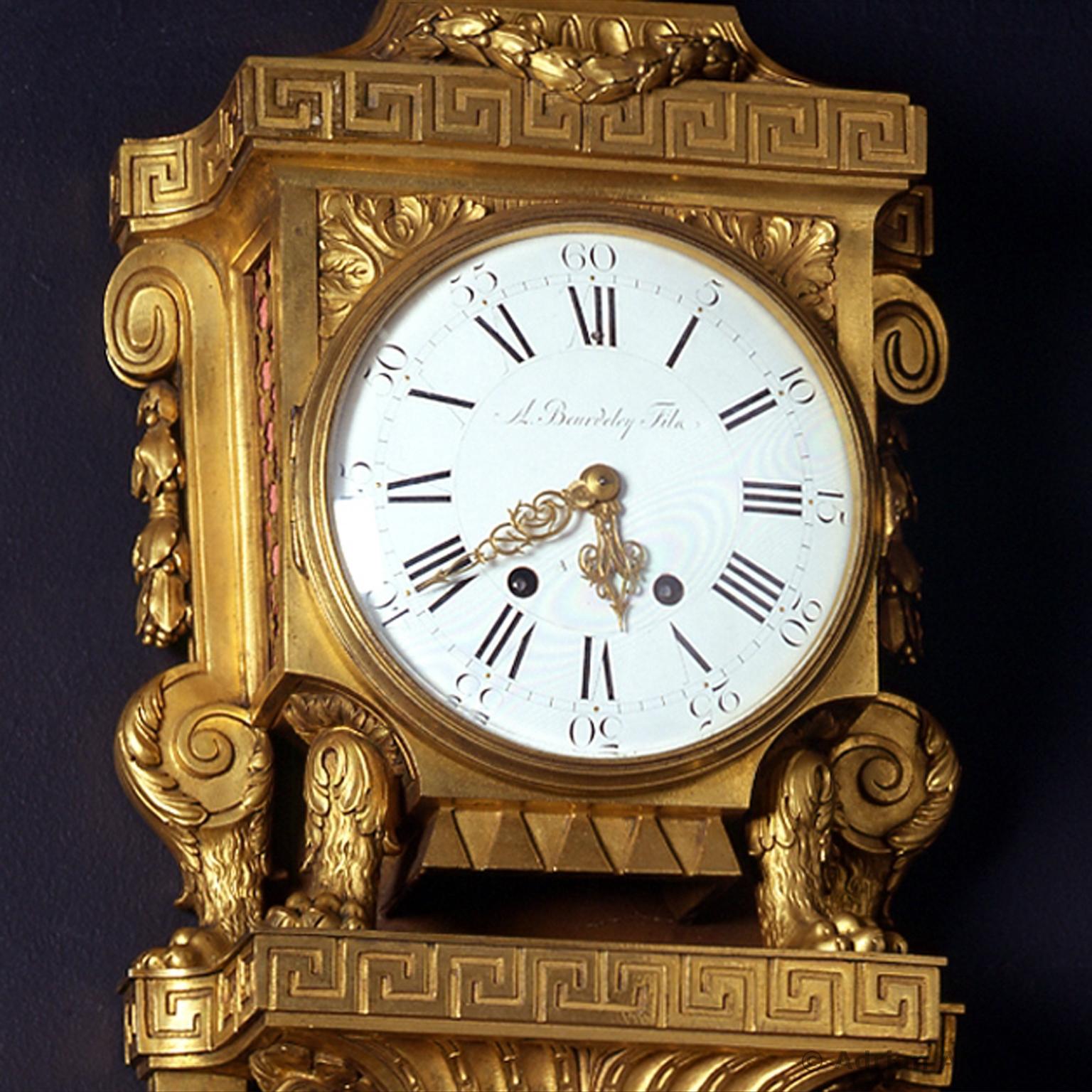 A fine Louis XVI style gilt-bronze Cartel clock, by Beurdeley. 

Signed 'A Beurdeley Fils à Paris'.

Surmounted by a ribbon tied globe the gilt-bronze case of this fine cartel clock presents a rich decorative vocabulary inspired by classical
