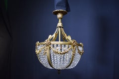 Kronleuchter aus vergoldeter Bronze und Kristall im Louis-XVI-Stil