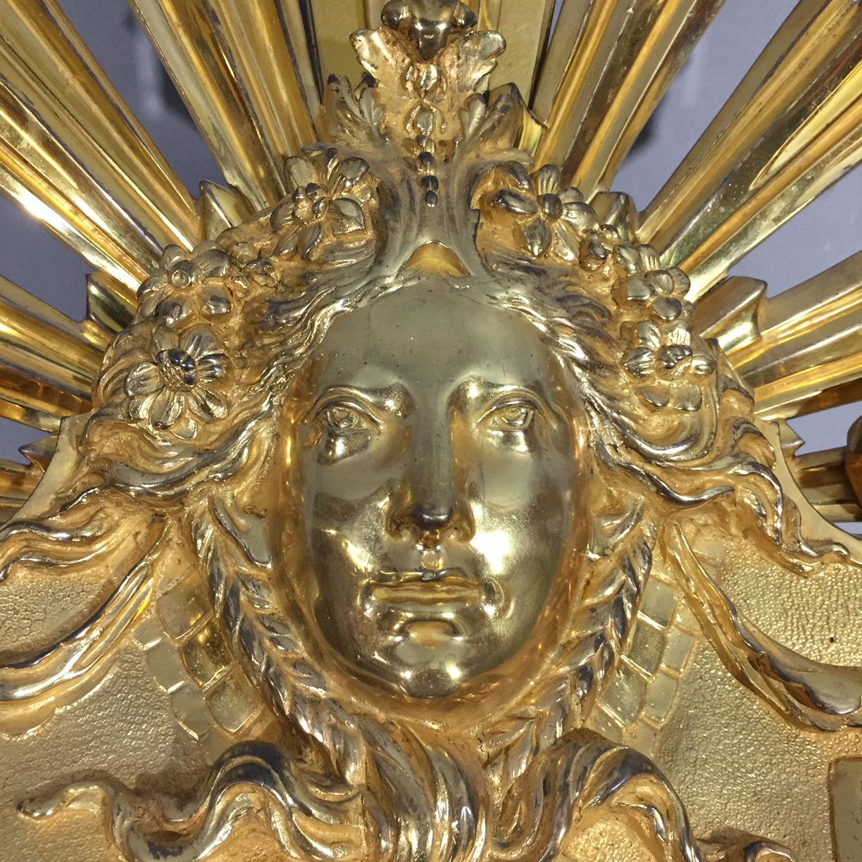 A large Louis XVI style gilt-bronze fan shaped fire screen with a finely cast mask of Apollo.

French, circa 1880.

Approximate dimensions:
Height 88 cm
Width 101 cm (open), 33 cm (closed)
Depth 25 cm.
 