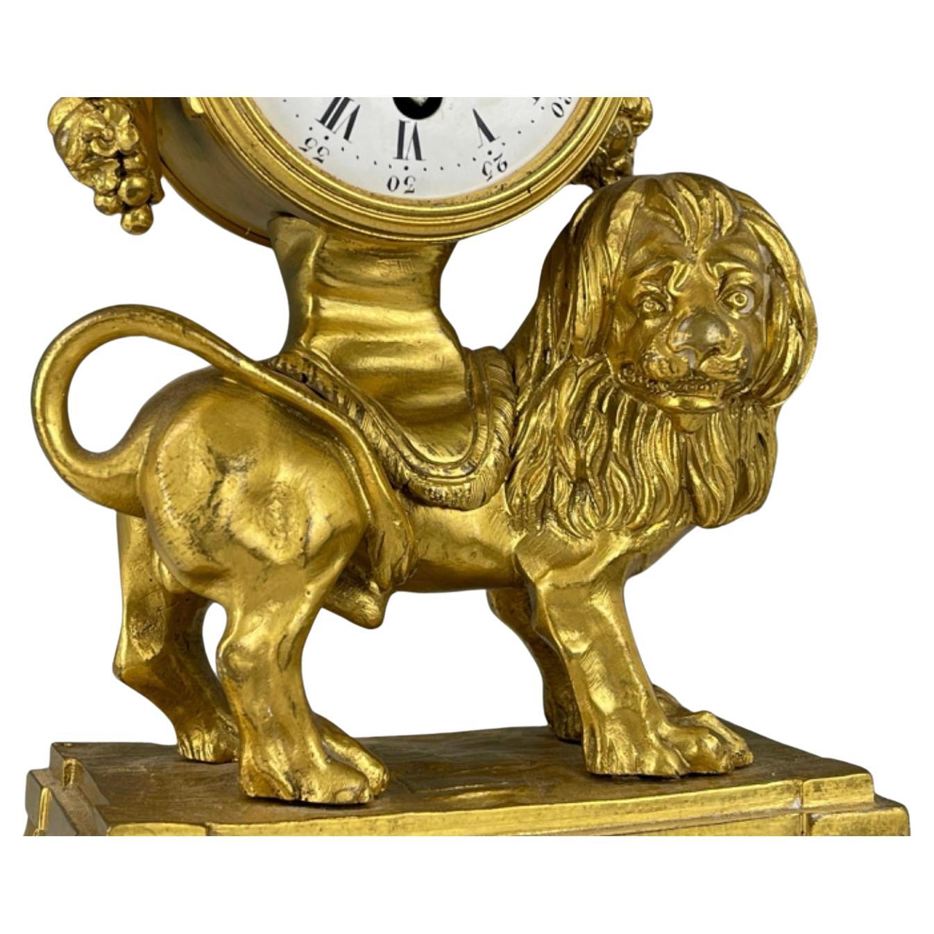 A very good quality Louis XVI Style Gilt Bronze Mantel Clock. French gilt bronze clock with enamel face, fruit and lion motif, on plinth. H 22.3 cm (8.8 in.),
All clocks sold as is with no guarantee they keep accurate time. 