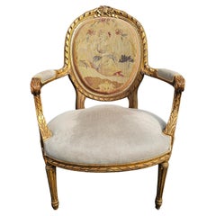 Fauteuil de style Louis XVI, doré, en cuir de daim et tapissé de points d'aiguille
