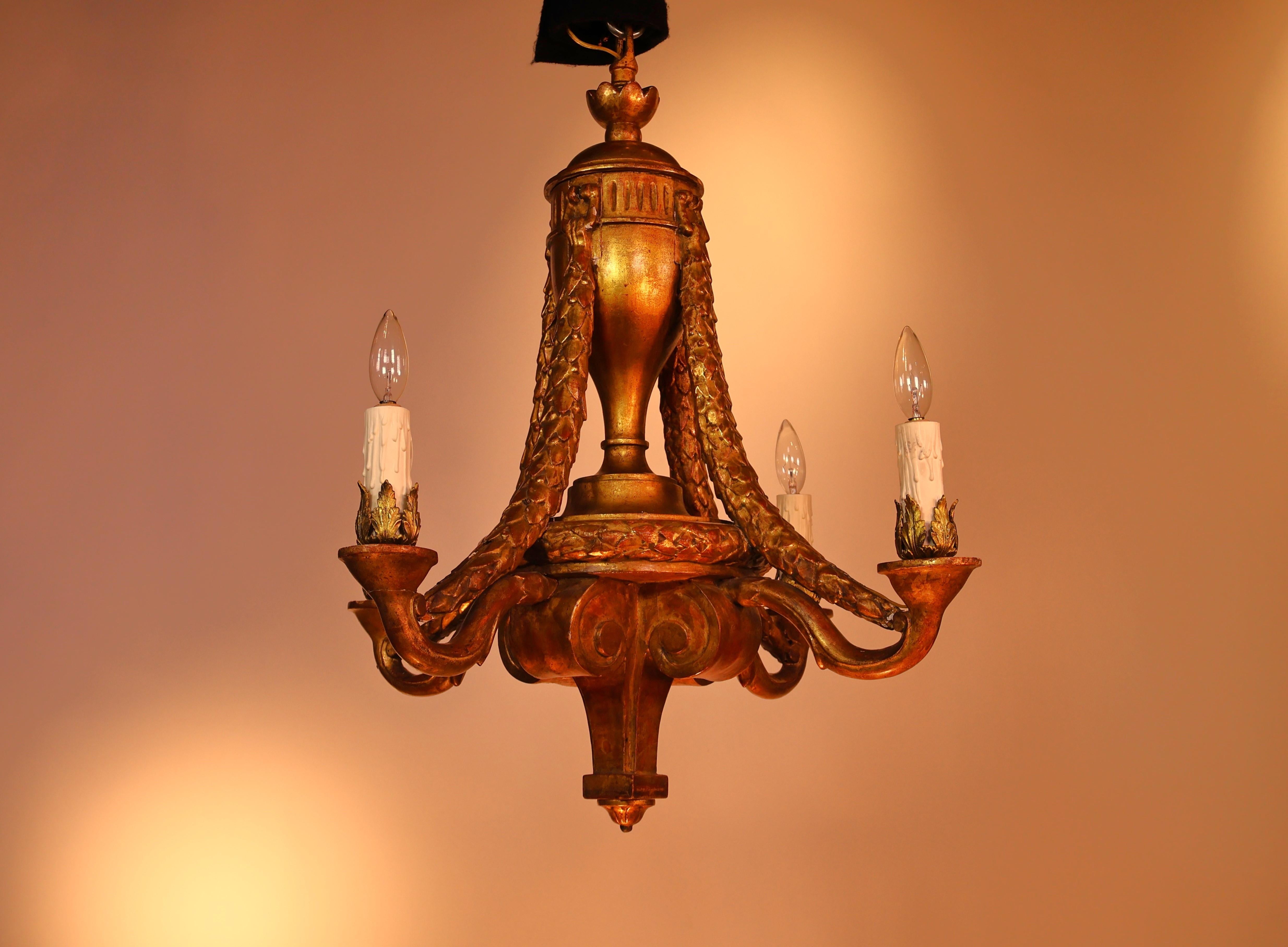A Very Fine late 19th Century Giltwood Chandelier in the Louis XVI style. Original gilding. 4 lights. France, circa 1890. 
Dimensions: Height 28 1/2