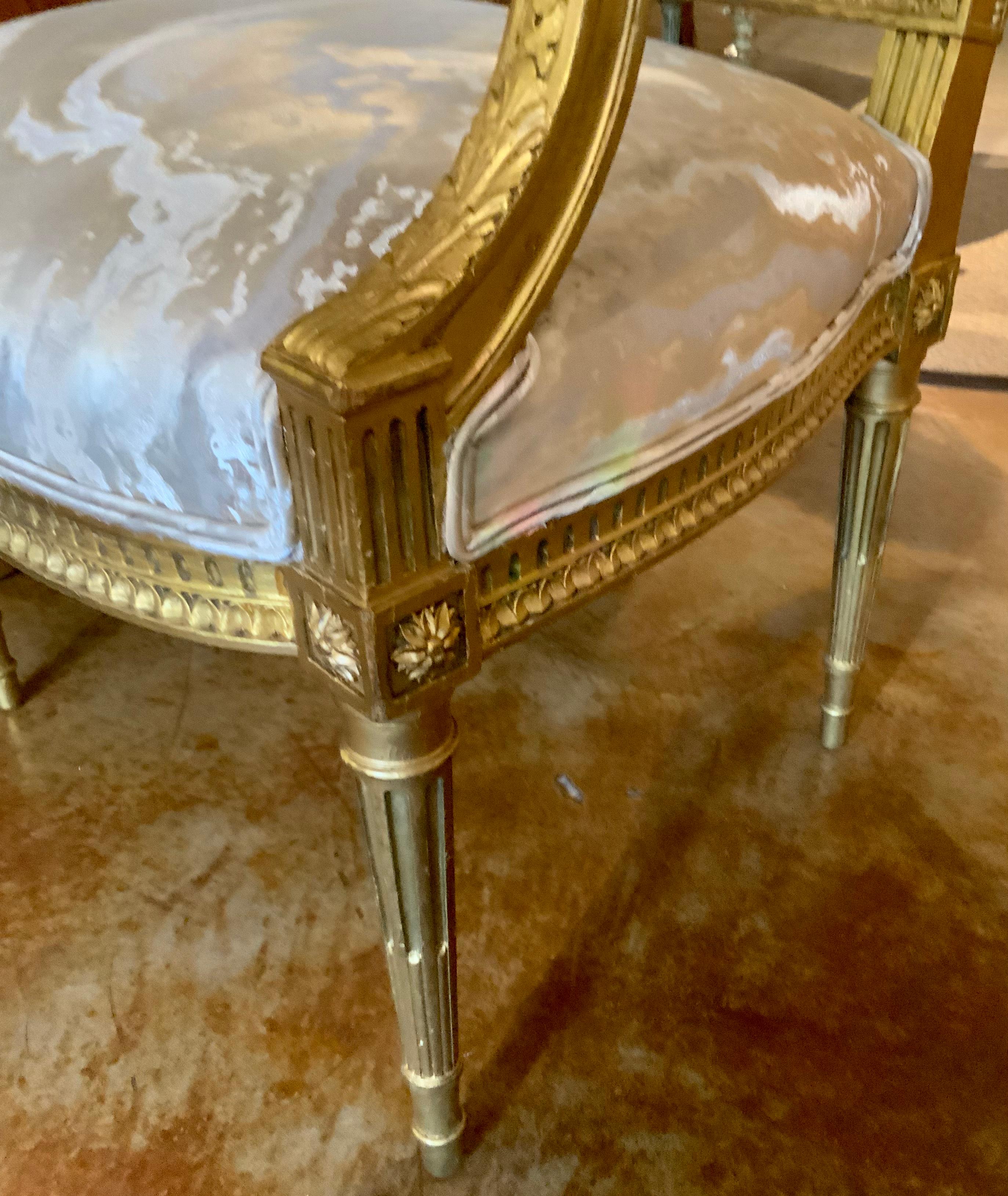 These chairs have the original gilt patina and fine carving which indicates 
Their age and style. They have been recovered in a more contemporary 
Upholstery fabric which elevates their style for interior projects of today.
They have reeded and