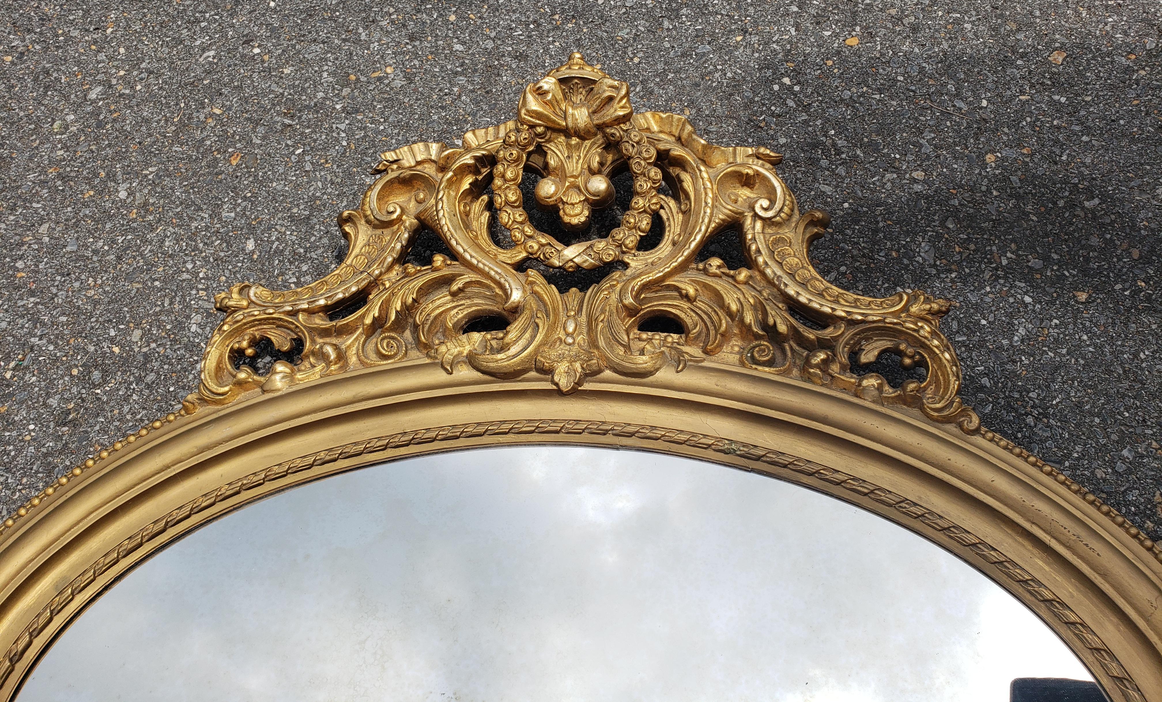 Hardwood Louis XVI Style Giltwood Decorated Oval Wall Mirror For Sale
