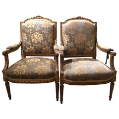 Fauteuils/sillones de madera dorada estilo Luis XVI, S. XIX con respaldo abovedado, Pareja