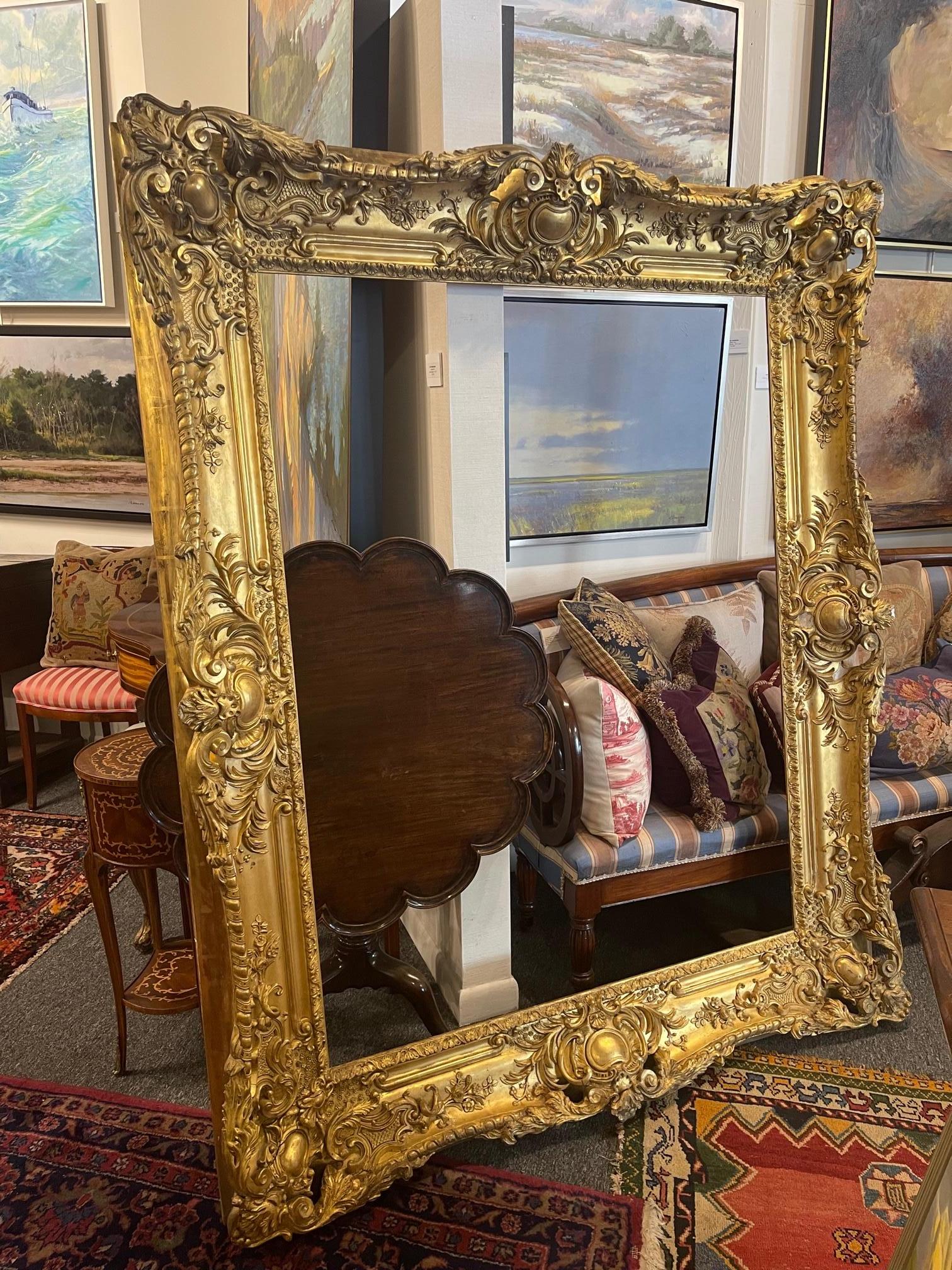 Very Large Louis XVI Style Giltwood Frame with Decorative Carved Designs, Early 20th Century.  Fantastic frame that could be use as is to be a piece of art on the wall or add a painting or a mirror plate.

Could be used horizontally or vertically
