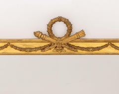 Miroir encadré en bois doré de style Louis XVI