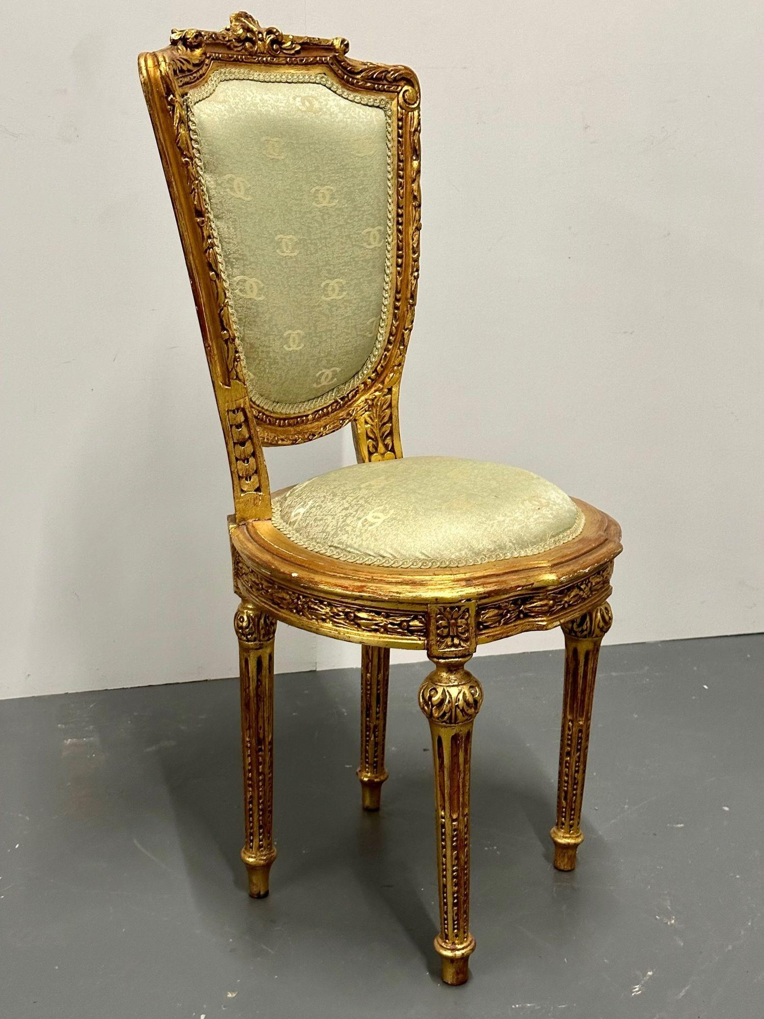 Louis XVI Style Giltwood hand carved side / accent chair, Chanel Fabric, 19th C.
 
Chic accent chair with later green Chanel embroidered fabric. The frame of the chair is intricately hand carved having a clayed gilt finish, giving the entirety of