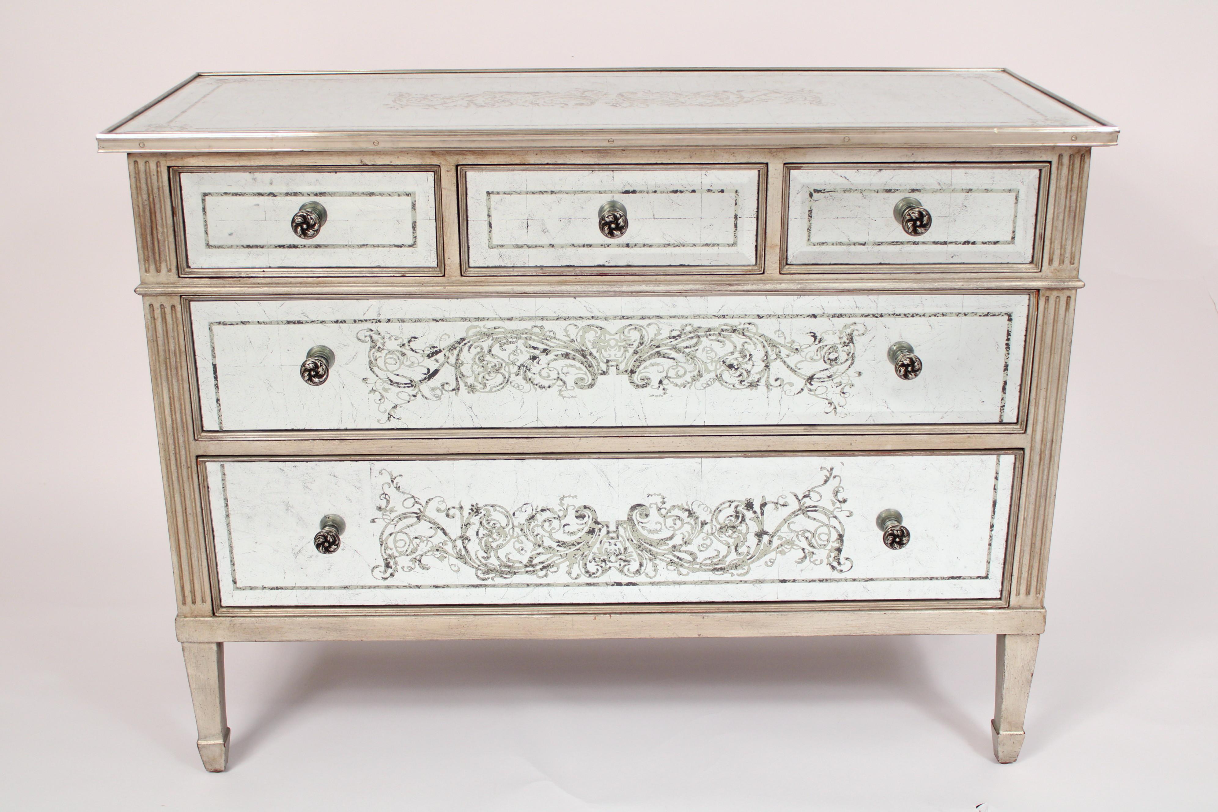 Louis XVI style glass clad chest of drawers, circa 1980's. With a rectangular over hanging top with metal moldings on front, side and back edges, three top drawers and two lower drawers, flanked by fluted columns, the chest resting on square tapered