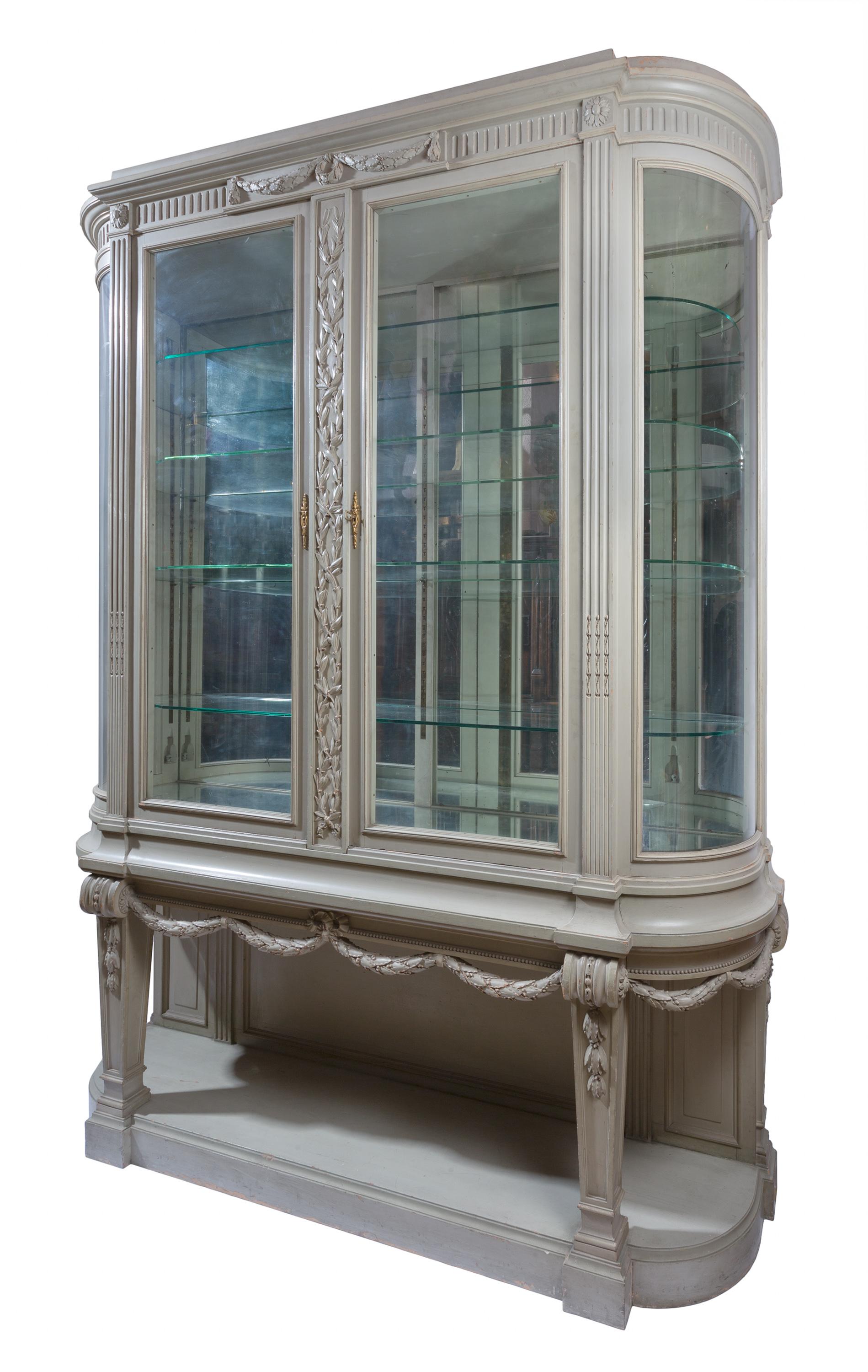 This rare 19th century Gris Trianon (Trianon Gray) Louis XVI style Vitrine / display cabinet / china cabinet by François Linke is constructed of oak and has its original (and unusual) painted grey-green finish. The vitrine was part of a larger group