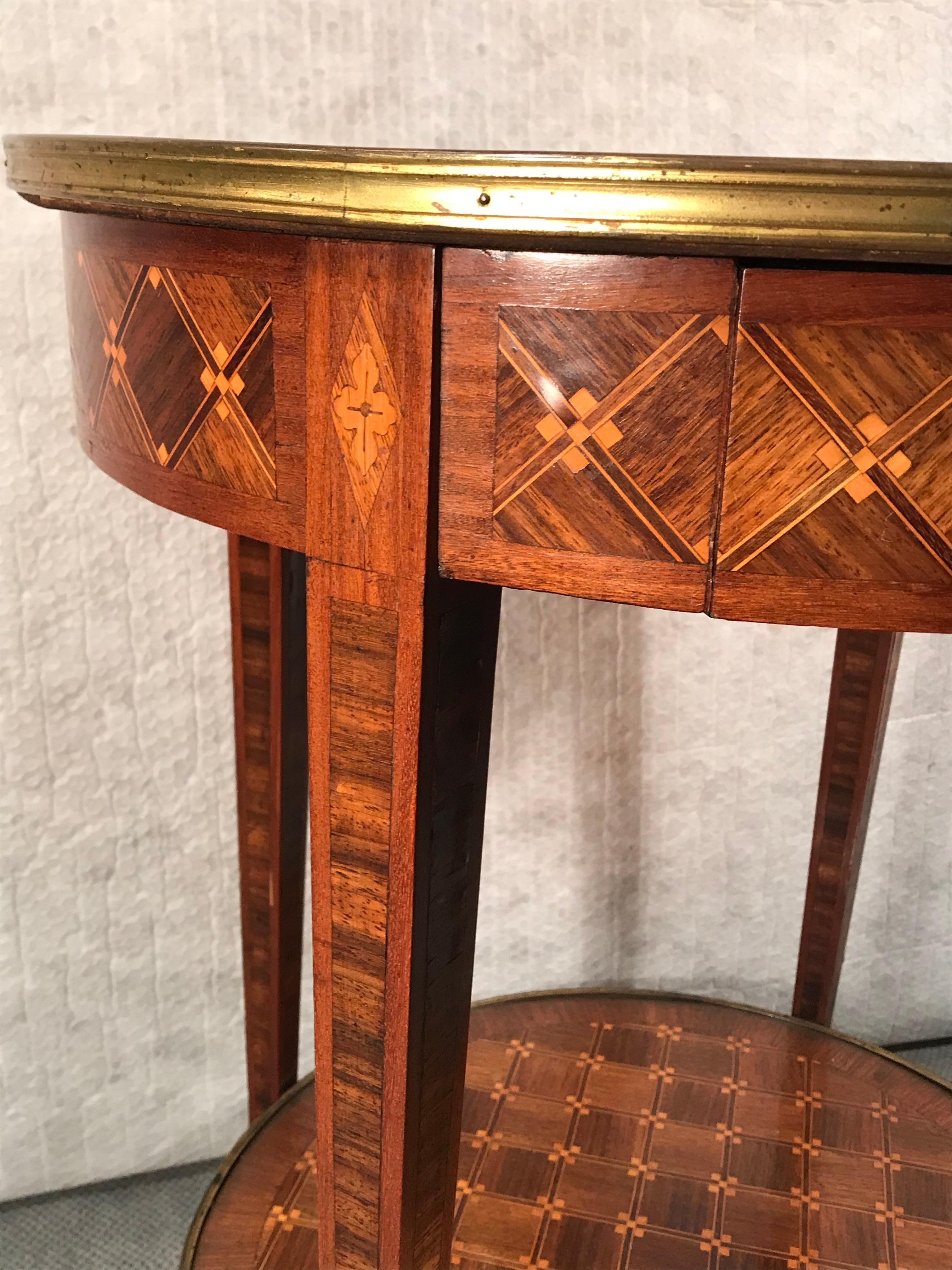 Louis XVI Style Gueridon, France circa 1890.
Beautiful marquetry in walnut, rosewood and satinwood. The table is in good original condition.
