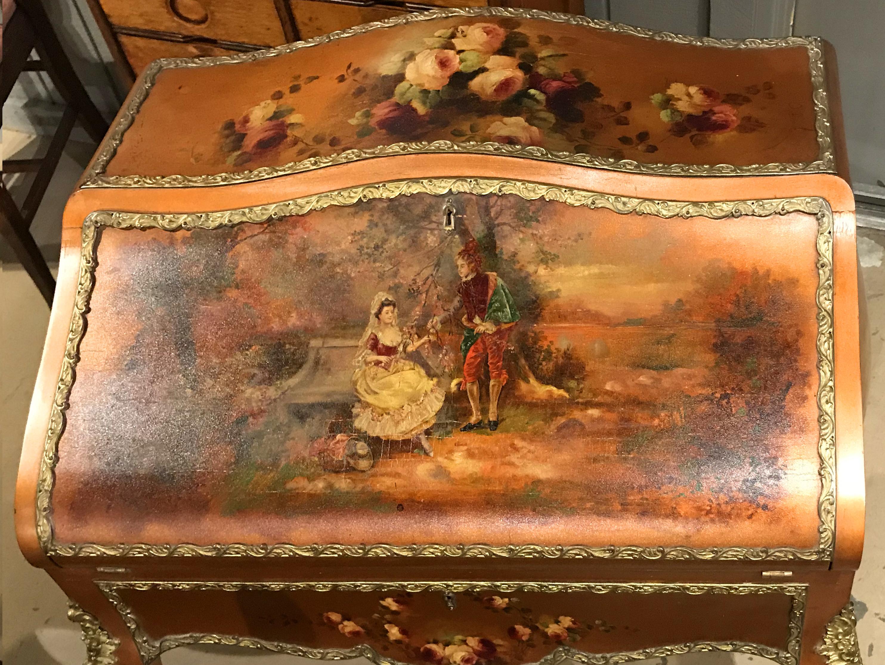 A wonderful Louis XVI style ladies slant front writing desk with hand painted genre and country landscape scenes on the lid and sides, as well as floral decoration painted on the top and lower drawer, opening to a compartmentalized interior and