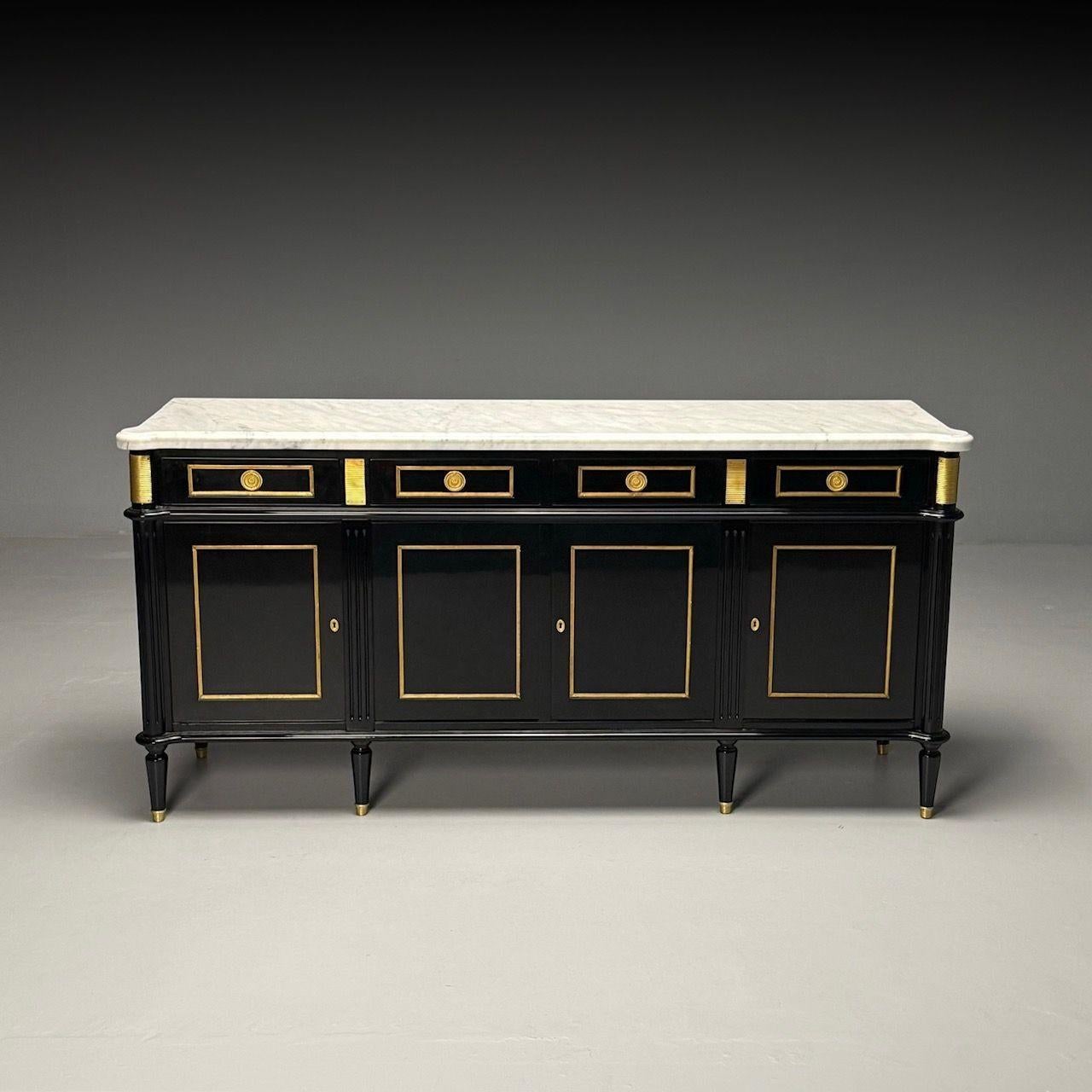 Louis XVI Style, Hollywood Regency, Sideboard, Black Lacquer, Marble, Bronze

This exceptional black lacquer sideboard is reminiscent of the sophisticated style of Maison Jansen. Crafted with a polished bronze frame featuring distinct cookie cutter