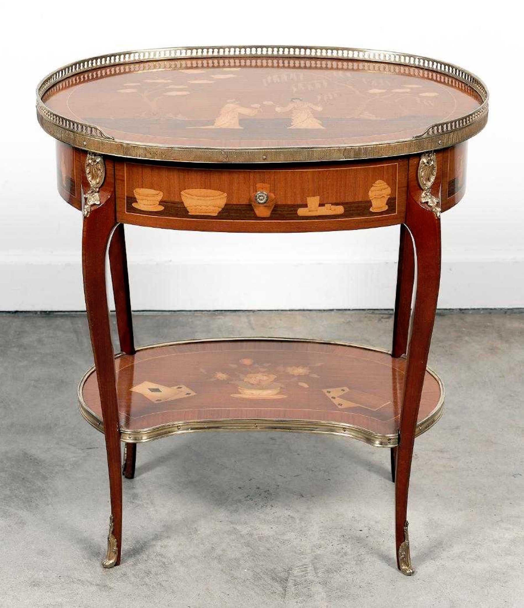 Louis XVI style king and tulip wood marquetry side table, with oval top, bronze gallery and chinoiserie exotic woods marquetry, fitted with one drawer.
Measures: Larger 26