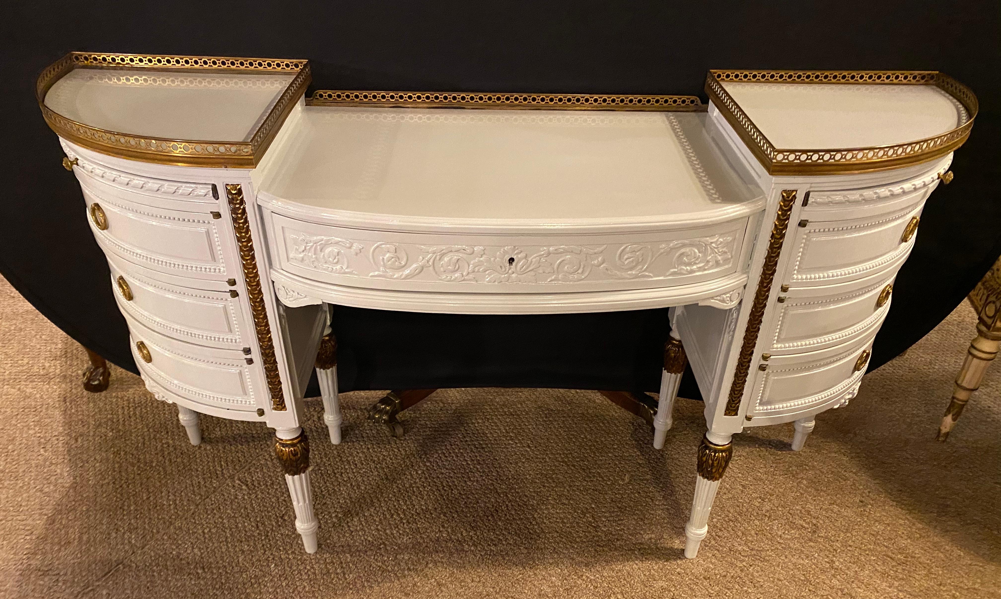 Louis XVI style ladies vanity / writing desk in dove gray lacquer and parcel-gilt gold finish. This spectacularly bronze mounted ladies desk or dressing vanity depicts the Hollywood Regency era at its peak. The fine, recently redone case, has a