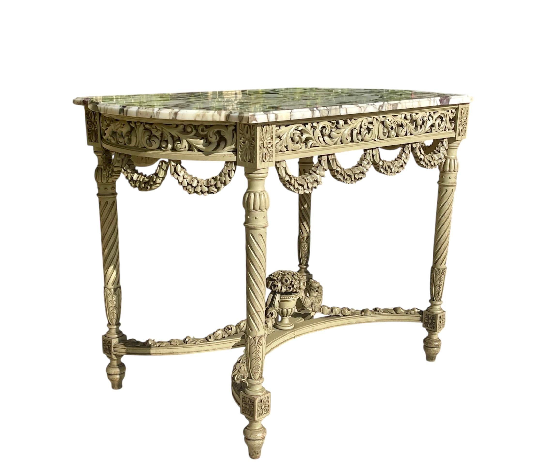 Lovely rectangular Louis XVI style center table with spandrels in lacquered wood, the leafy belt is openwork, it rests on four legs with twisted fluting connected by floral garlands, the X-shaped spacer topped with a cup on a pedestal holding the