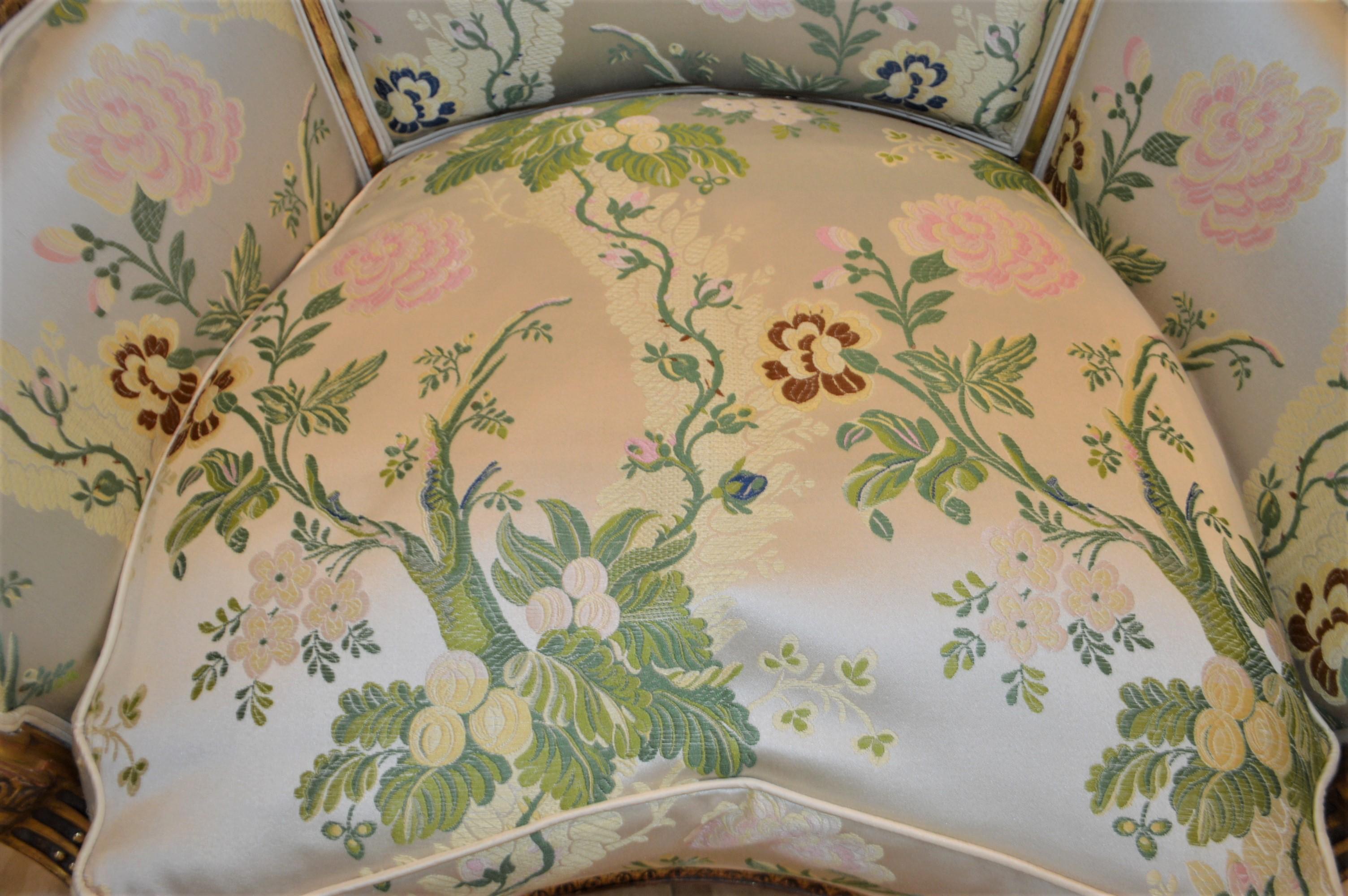 Wood Louis XVI style leaf gilded bergere chair, hand carved, silk botanical fabric.
