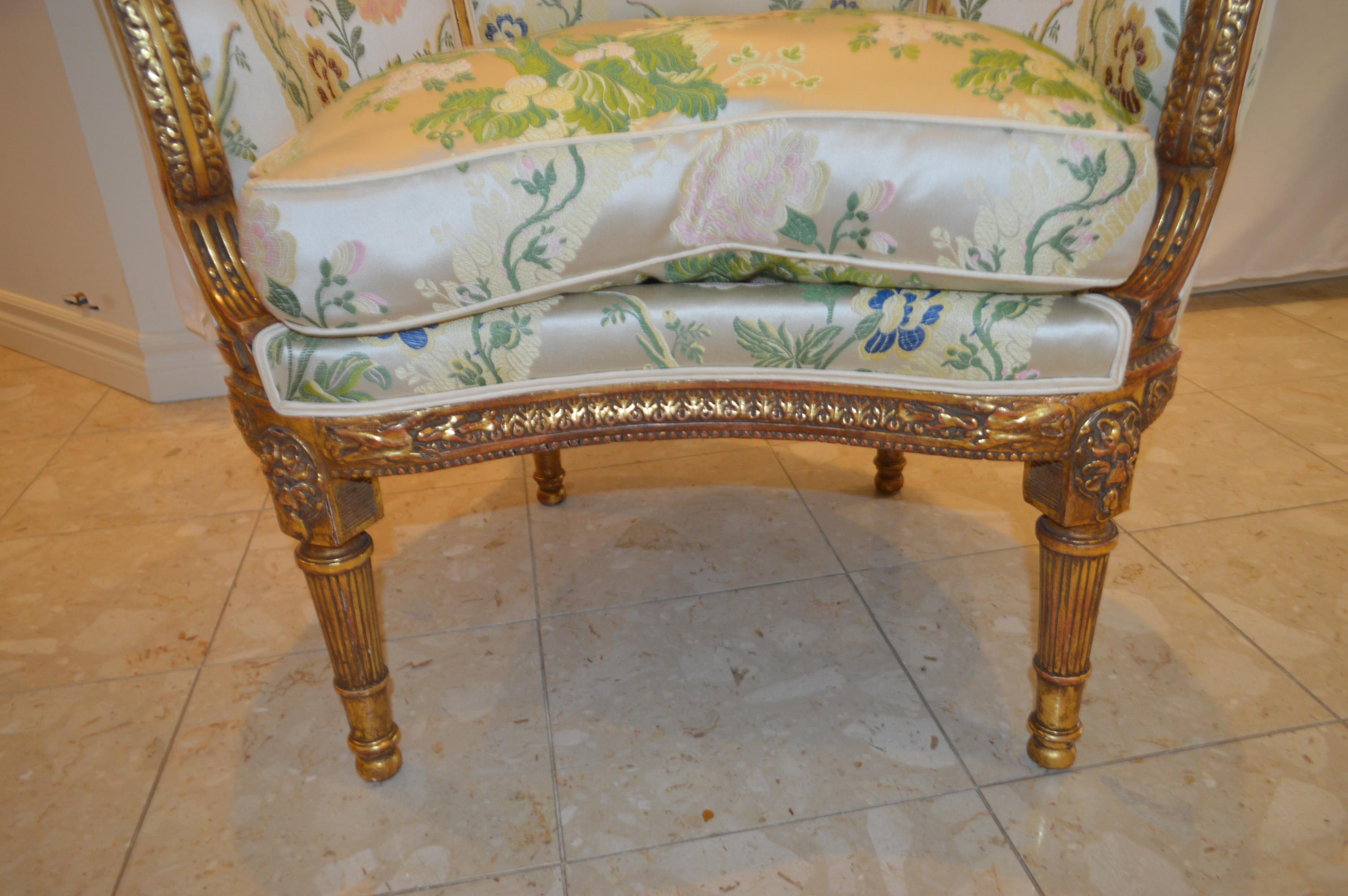 Louis XVI style leaf gilded bergere chair, hand carved, silk botanical fabric. 1