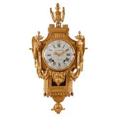 Horloge murale à masque de lion de style Louis XVI