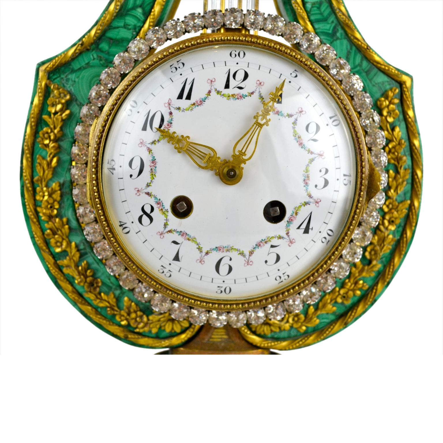 A fine late 19th century example of an 18th century Louis XVI malachite lyre mantel (fireplace) clock with musical references. Most examples of this model usually have white marble or ‘Sevres’ porcelain ‘frames’, malachite being an unusual and