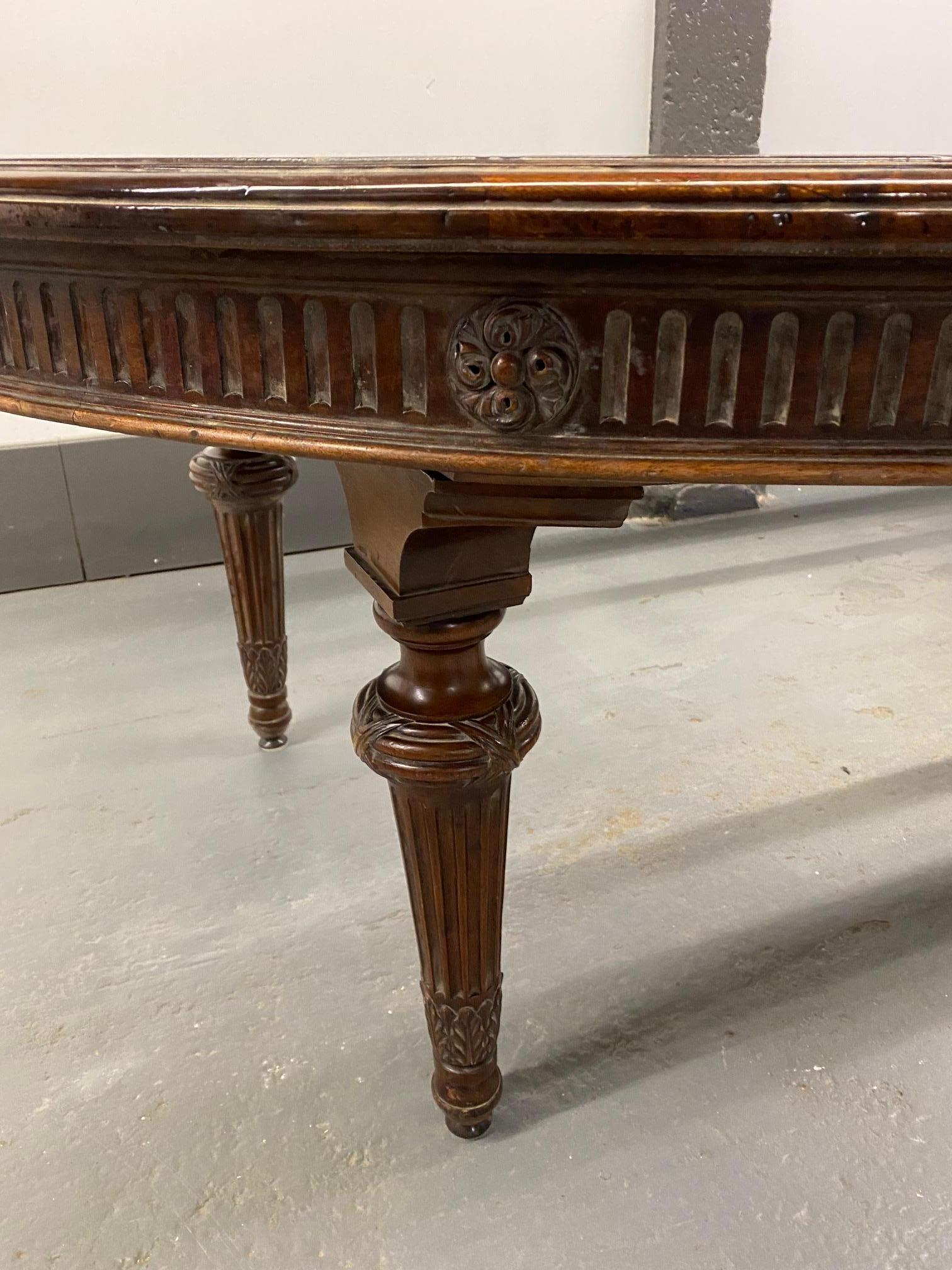 Louis XVI style mahogany dining table including 3 extensions which needs to be refinish. Length when fully extended 178.5 inches.