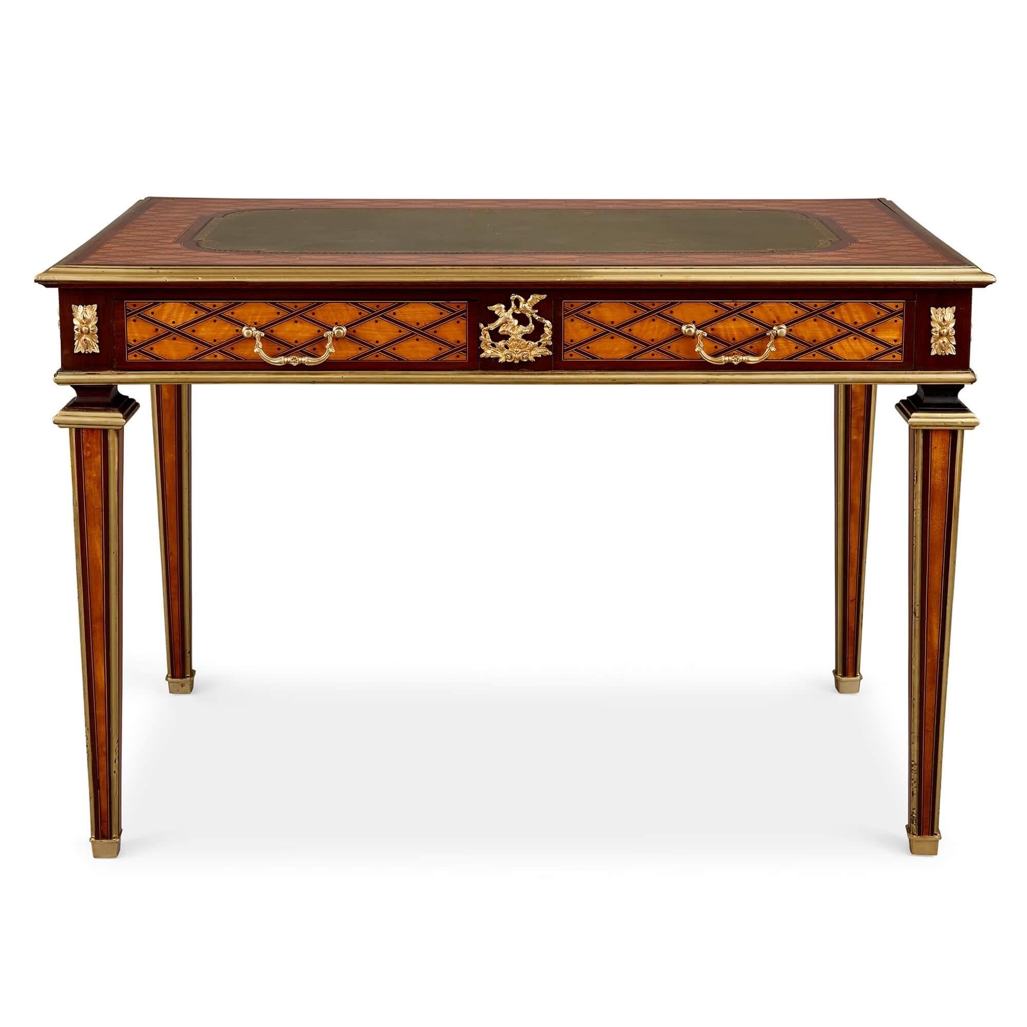 Louis XVI style mahogany, satinwood, ebony and ormolu writing desk by Donald Ross
English, Late 19th Century
Height 73cm, width 108cm, depth 64cm

This excellent piece, a table à écrire, or writing desk, was made by Donald Ross, an important