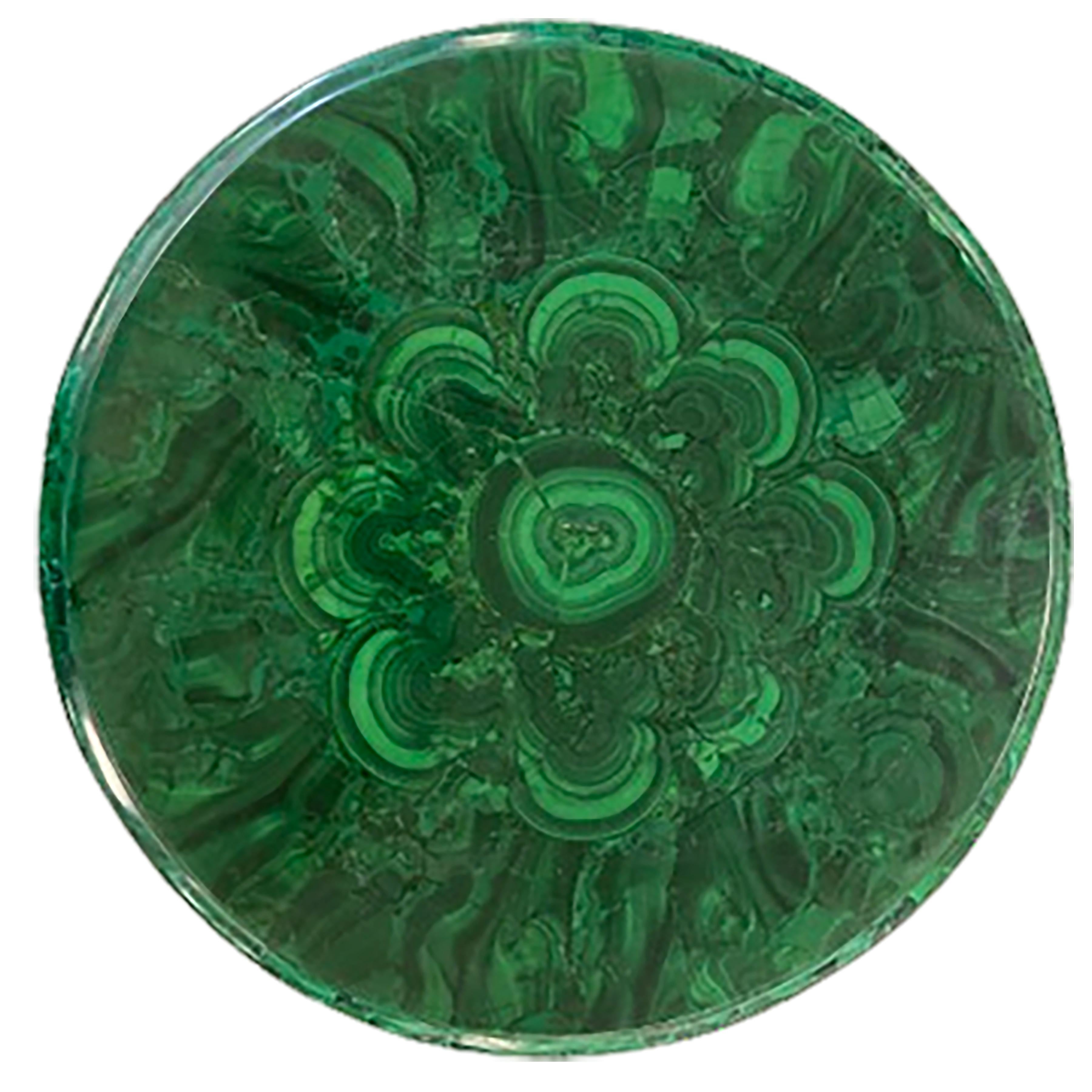 A charming Empire antique malachite side table with detailed features and ormolu legs. The vibrant organic green of the table top contrasts the finely crafted features that make up the legs and side. The malachite table top is laid in an expanding