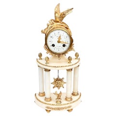 Pendule Sun King de style Louis XVI en marbre et bronze doré 