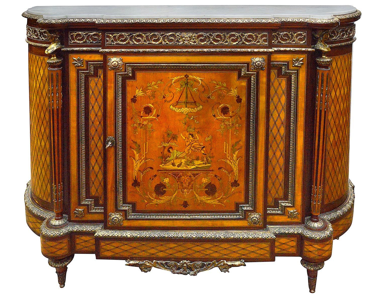 A fine quality late 19th Century French parquetry and marquetry inlaid Side cabinet. Have the original white marble top, trellis marquetry to the bowed sides, scrolling gilded ormolu mounts to the frieze, wonderful marquetry panel. to the central