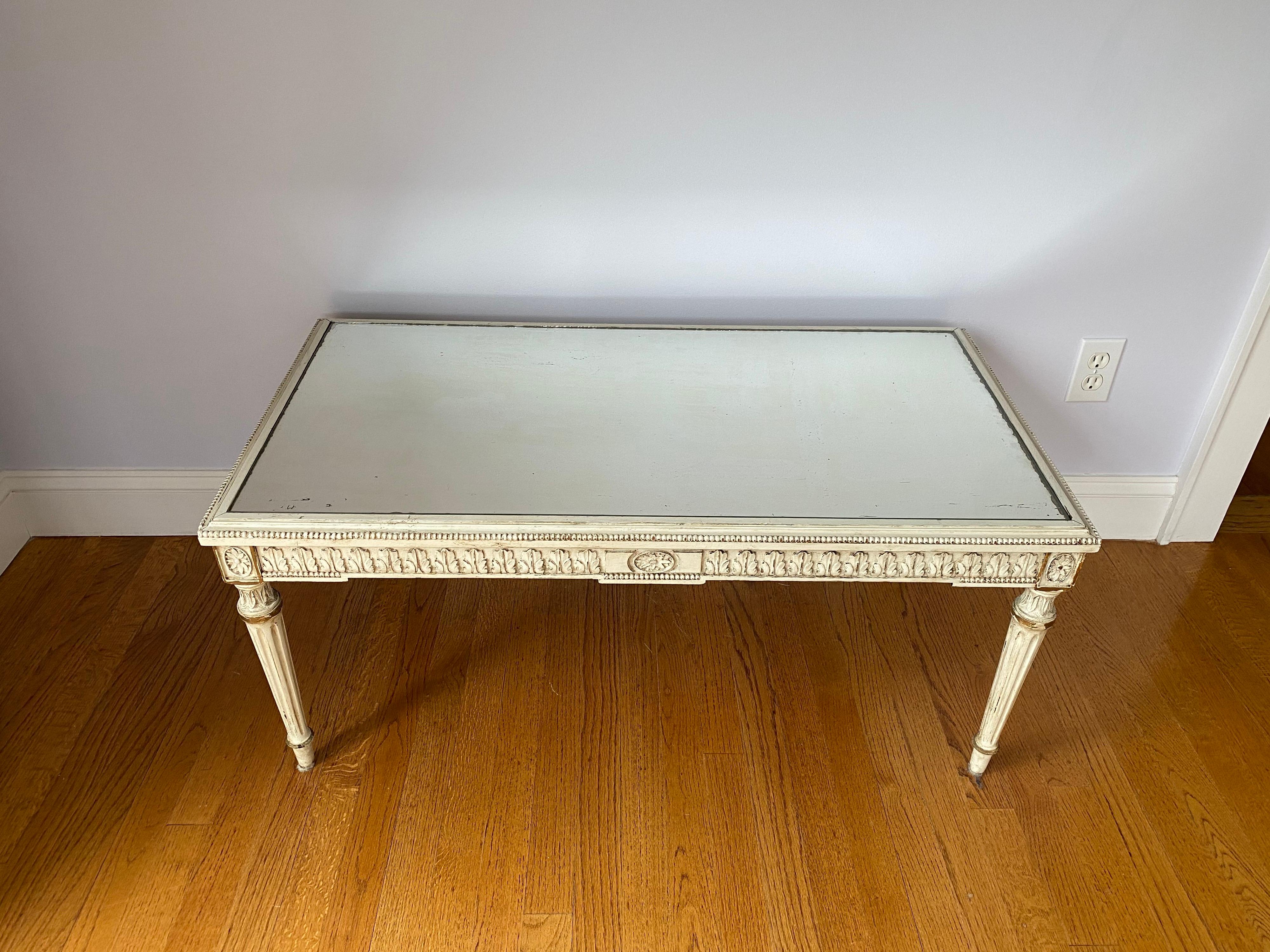 Louis XVI style mirrored coffee table, 20th century
Classic French design, great proportions
Squared Rosette, fluted, tapered legs and a frieze of acanthus leaf motifs and beaded around the edge.
Measures: 38 1/8