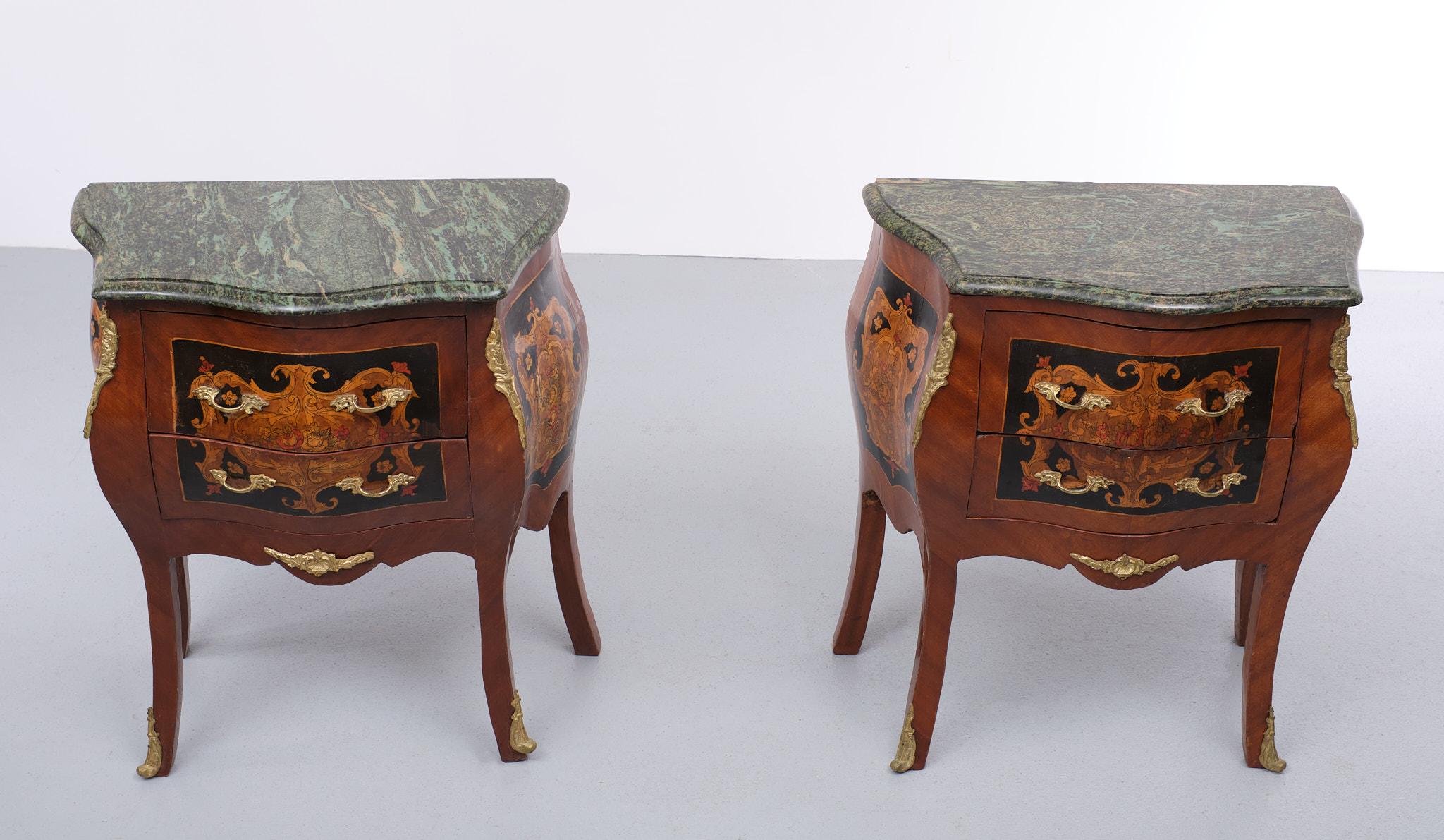 For sale two very nice decorative nightstands. Italian inlay wood, comes with marble 
curved Greenish color tops. Bronze handles and details. Two drawers each.