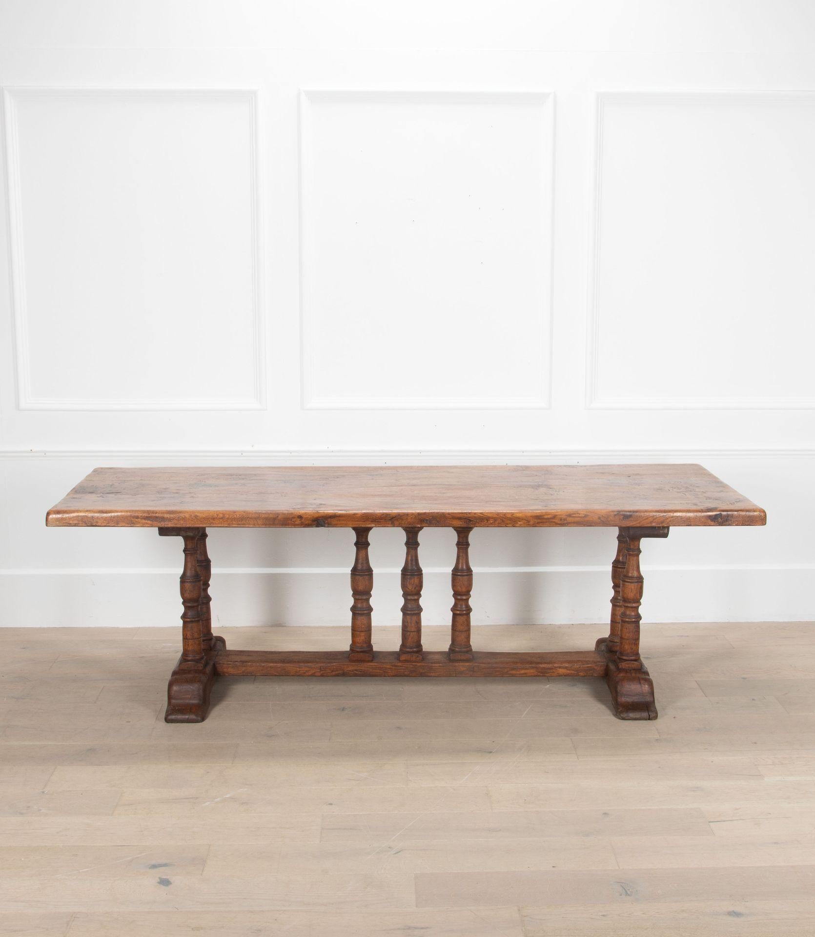 Great example of an early 20th Century oak refectory style dining table. 
Constructed from solid oak, the top comes off the base for ease of transportation/delivery. Will seat eight people. 
French, Circa 1920s.