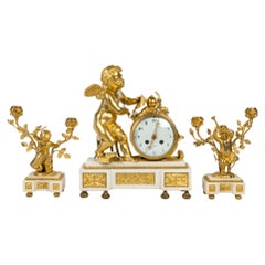 Louis XVI Style Ormolu and White Marble Mantel Set, 19th Century.