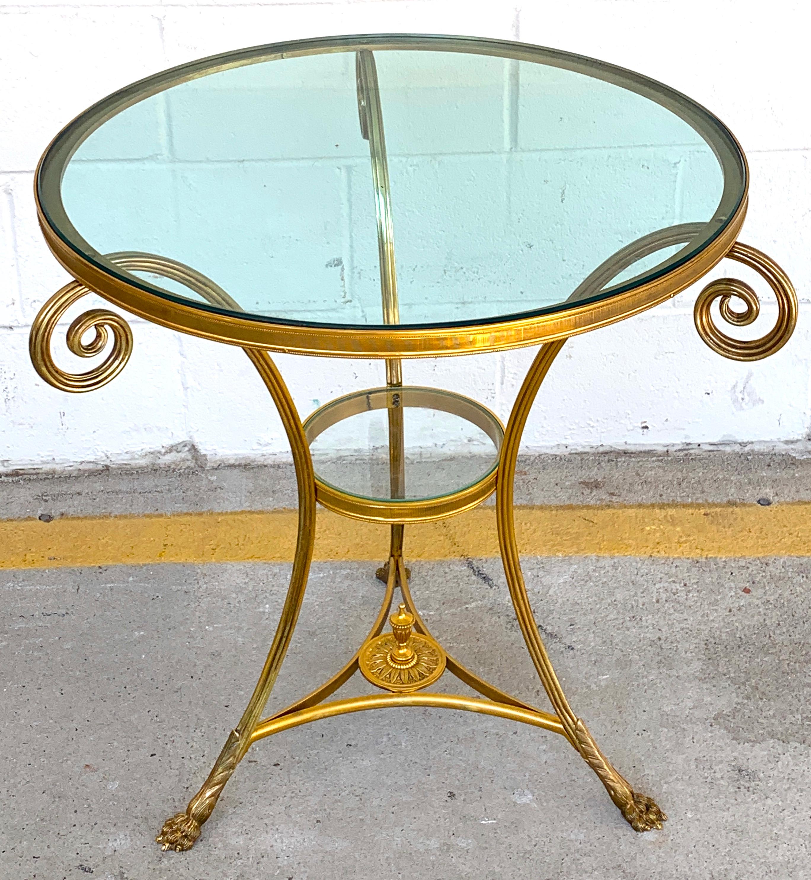 Louis XVI style Ormolu & Baccarat (Attributed ) glass gueridon, of typical form, with thick inset beveled 24 inch diameter crystal roundall, this not commercial glass. The second tier has a 8-inch diameter removable glass shelf, the crystal top is