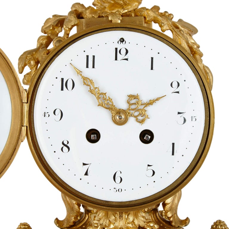 French Louis XVI Style Ormolu Mounted Malachite Column Mantel Clock For Sale