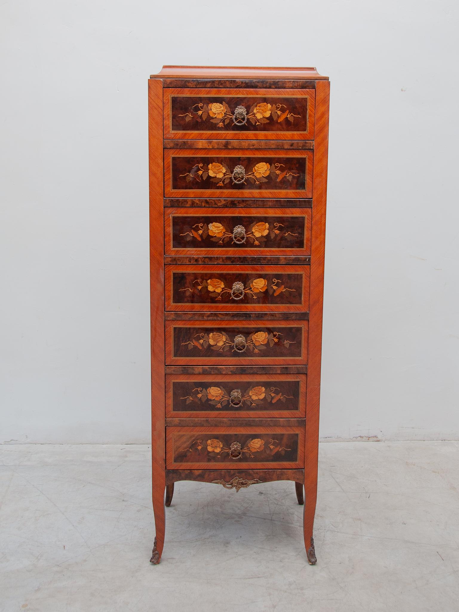 A Beautiful Louis XVI style ormolu-mounted marquetry  seven drawers tall rectangular dresser each drawer with nice floral marquetry designs. In original good condition.