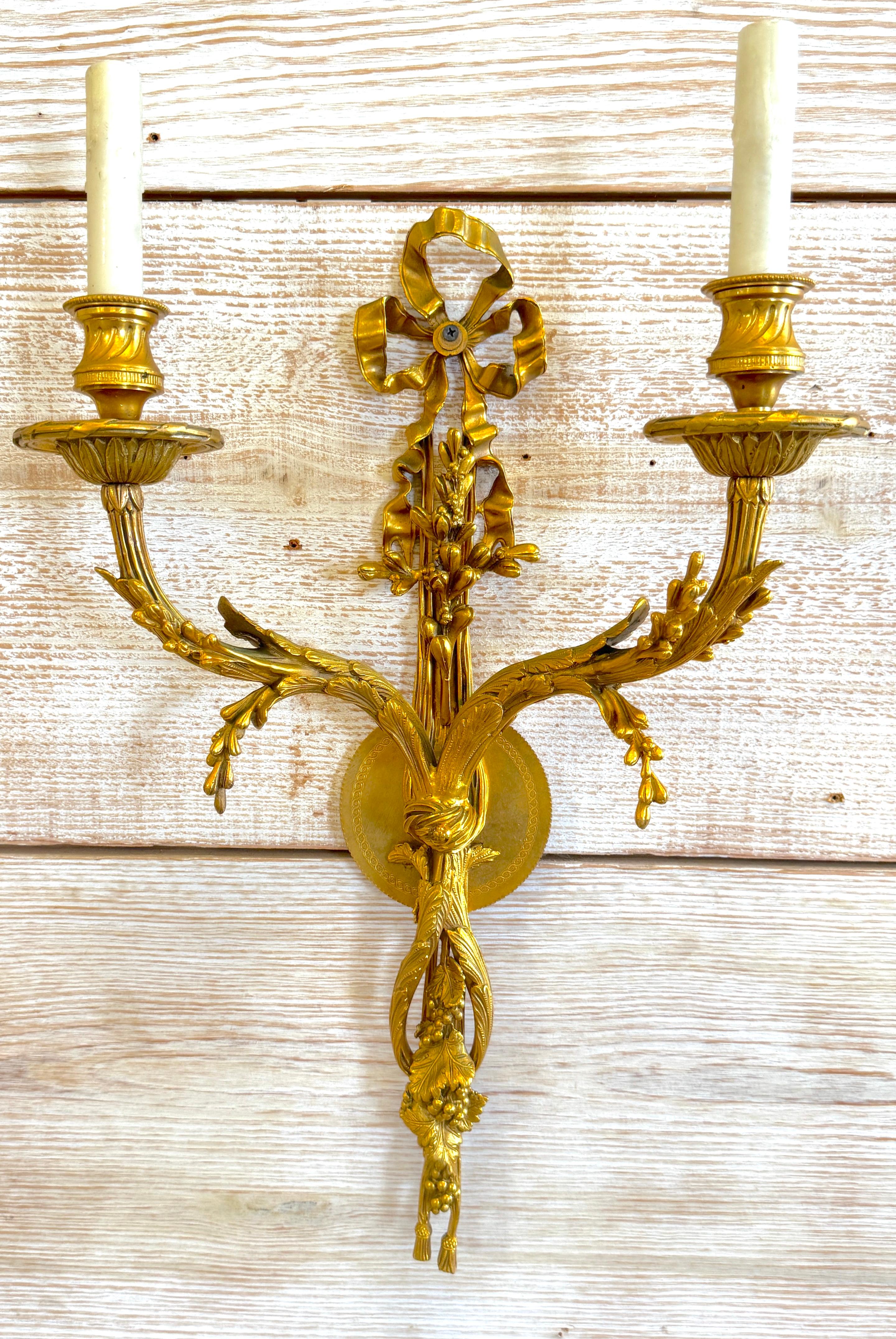 20th Century Louis XVI Style Ormolu Two‑Light Sconces, Attributed to P.E. Guerin For Sale