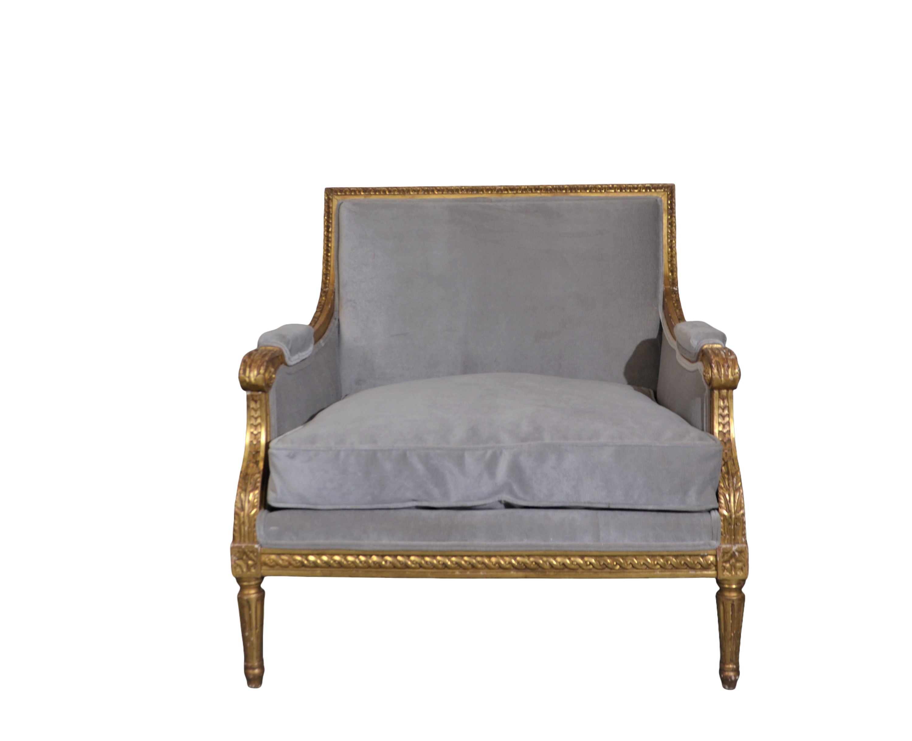 Louis xvi style oversize accent chair. Carved wood frame gilded finish and upholstered in velvet fabric.