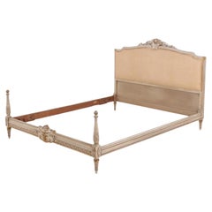 Louis XVI style painted and gilt carved bed C 1930.
