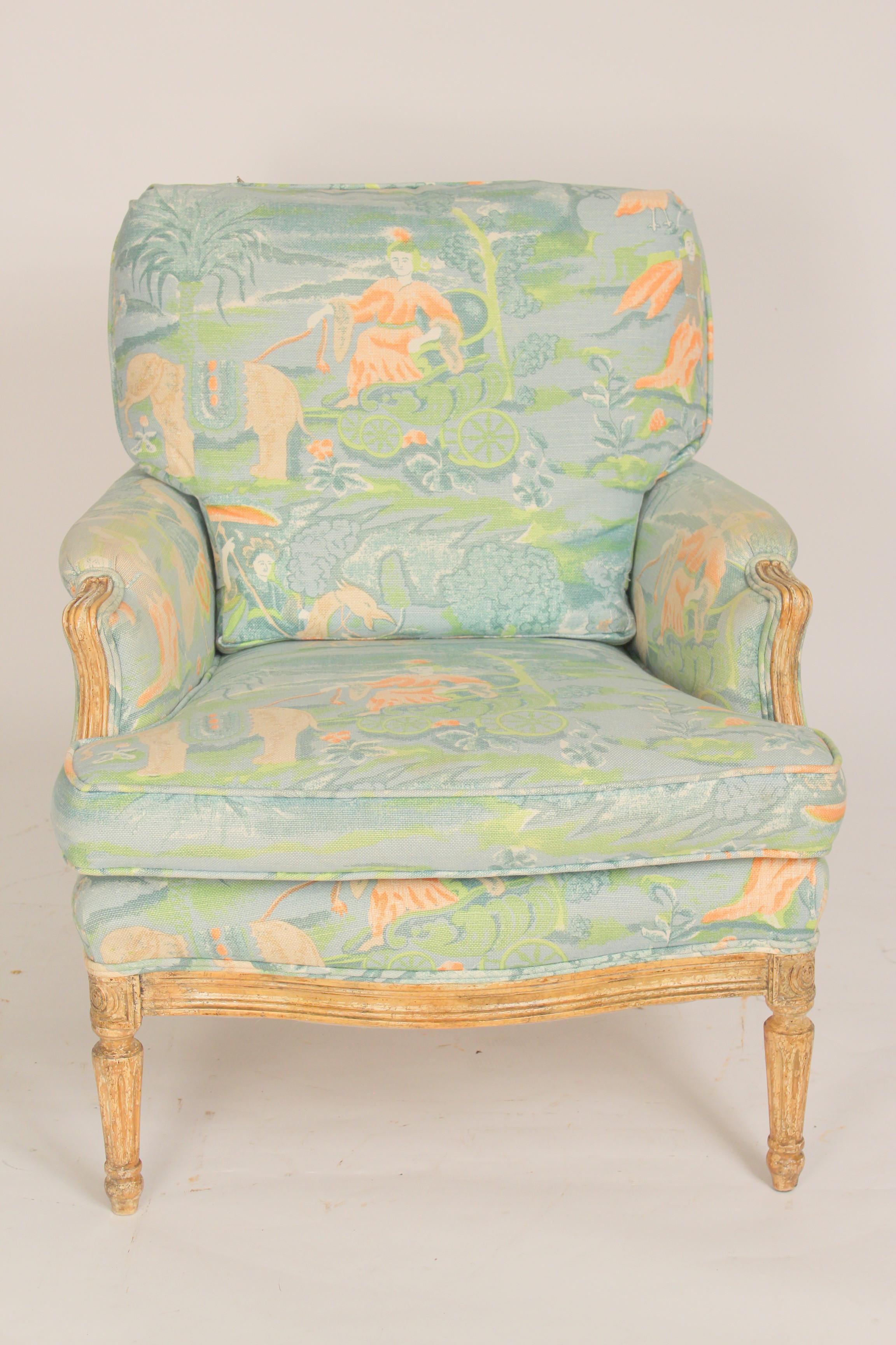 Louis XVI style bleached wood and painted bergere, late 20th century. Exotic Asian Style upholstery. Back cushion is down filled. This chair has a deep seat and is comfortable to sit in.