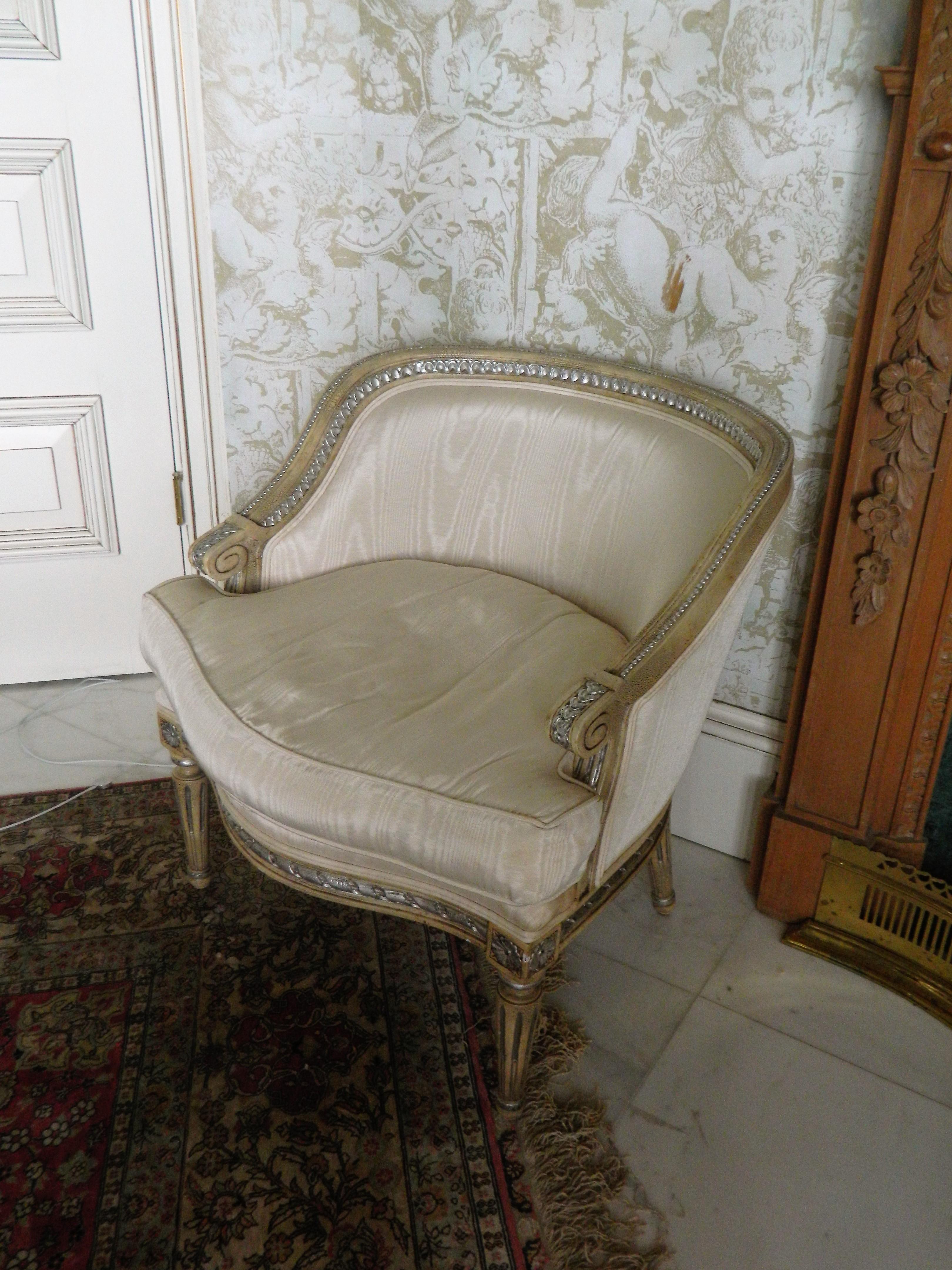 Louis XVI style painted boudoir or bergere chair, 20th century. Chair requires new upholstery. Stains on the back of the chair.