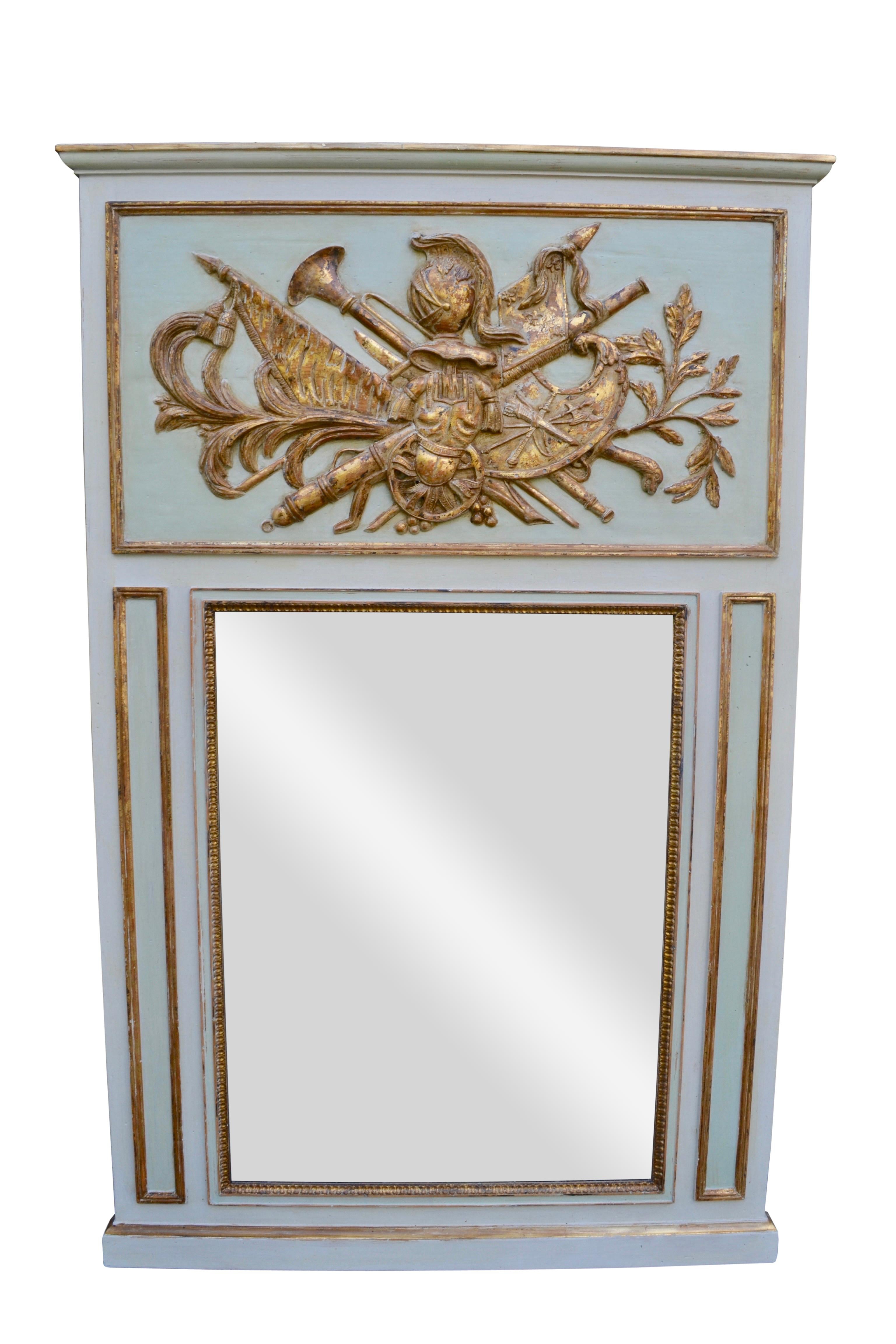 A 20thC copy of a French Louis XVI demi-lune console and over mirror. Both pieces are painted in a two toned light blue/grey with gilded highlights to the decorative elements on both pieces, ie. gilded filets, rosettes, framing, and especially the