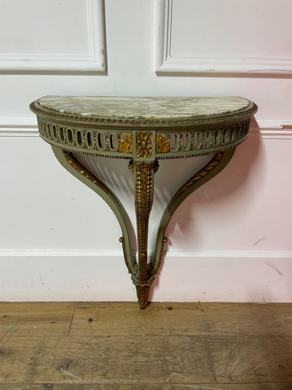 Early 20th century, very pretty Louis XVI style painted Demi lune console table.
French circa 1900.With original paint Finish and marble.
Height 33.5 inches
Width 24 inches
Depth 13.5 inches