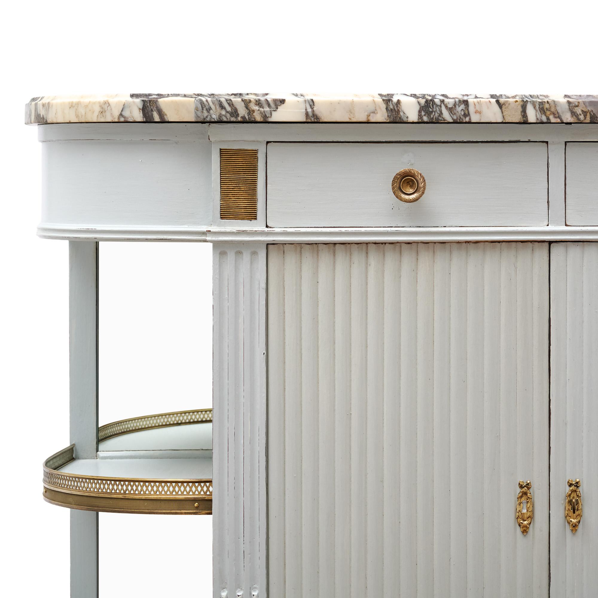Buffet from France in the Louis XVI style. This cabinet  is crafted in solid and veneer mahogany that has been hand-painted in a light dove “Trianon” blue gray color. The demilune shape is a classic French detail. The sides of the base are open,
