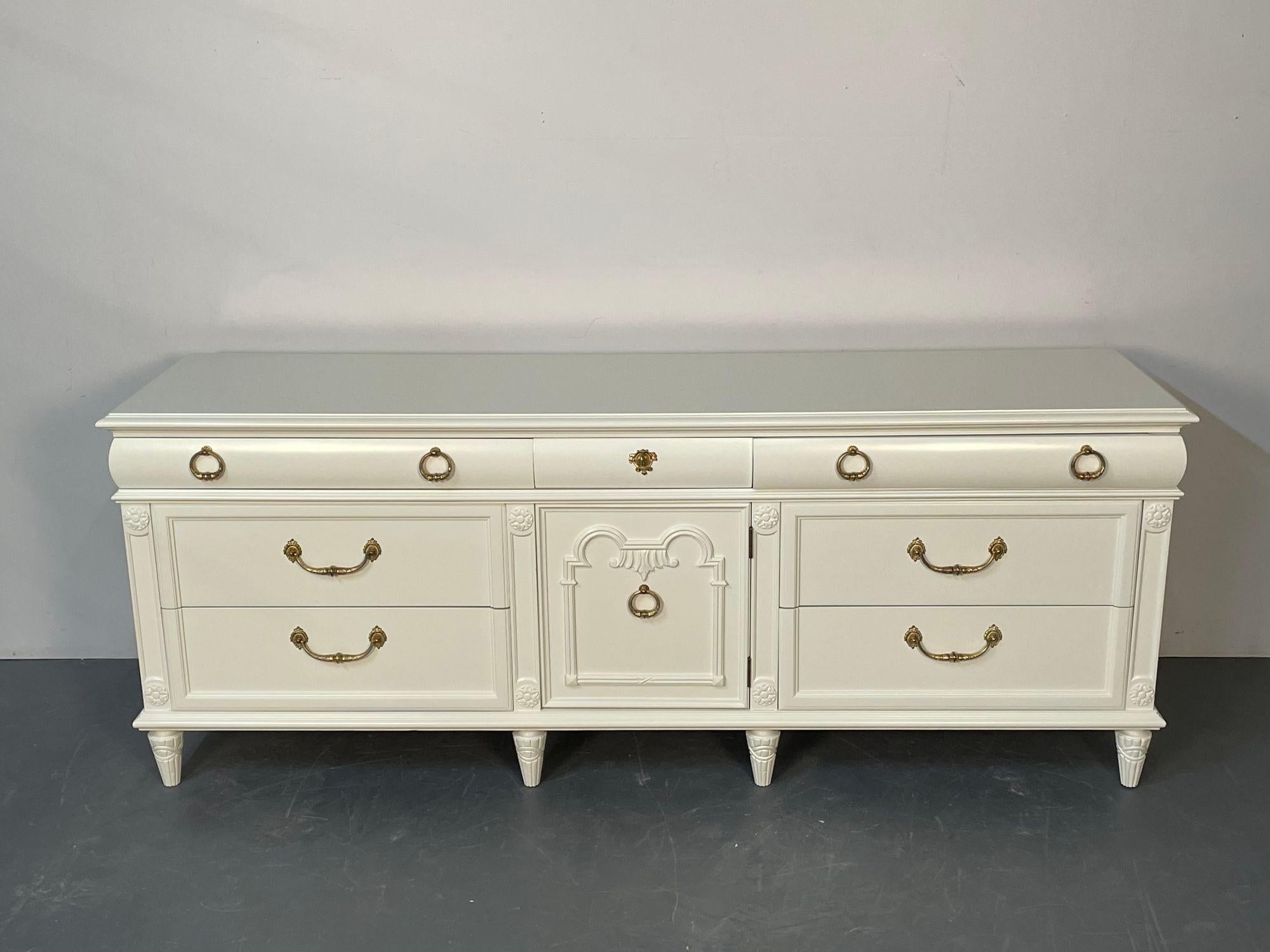 Louis XVI Style Painted Dresser, Mid-Century Modern, Commode, Bronze, Off White
 
An off linen white professionally refinished double chest or dresser. A finely crafted solid wood chest from the 1940s with stunning bronze cast drawer pulls. The