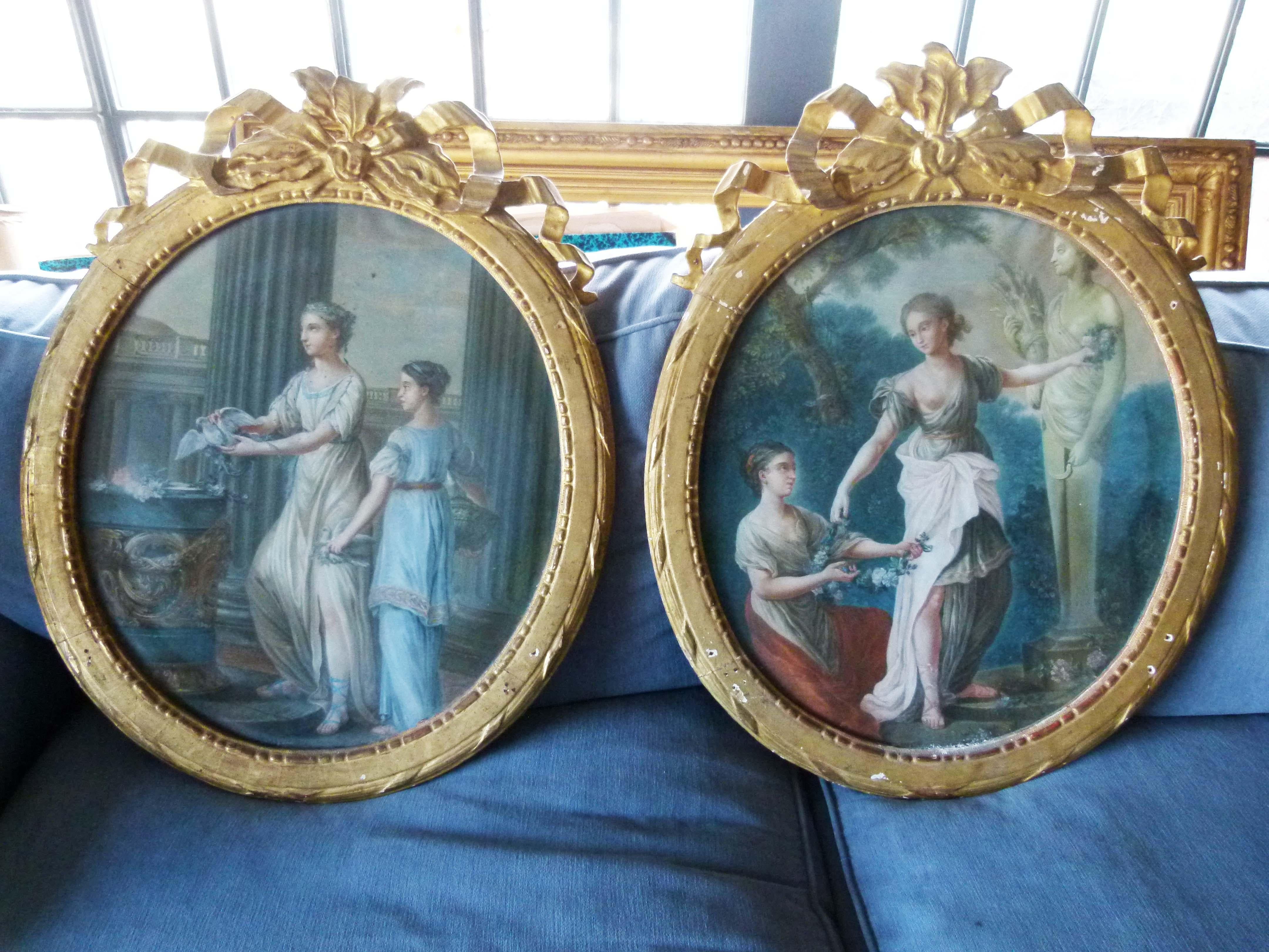 Louis XVI style pair of oval shaped pastel paintings, France. 
Nice in blue predominant colors figurative paintings with their wounderful carved frames.

Wooden carved frames measurements: 74 x 60 cm 
Paintings measurements: 55 x 49