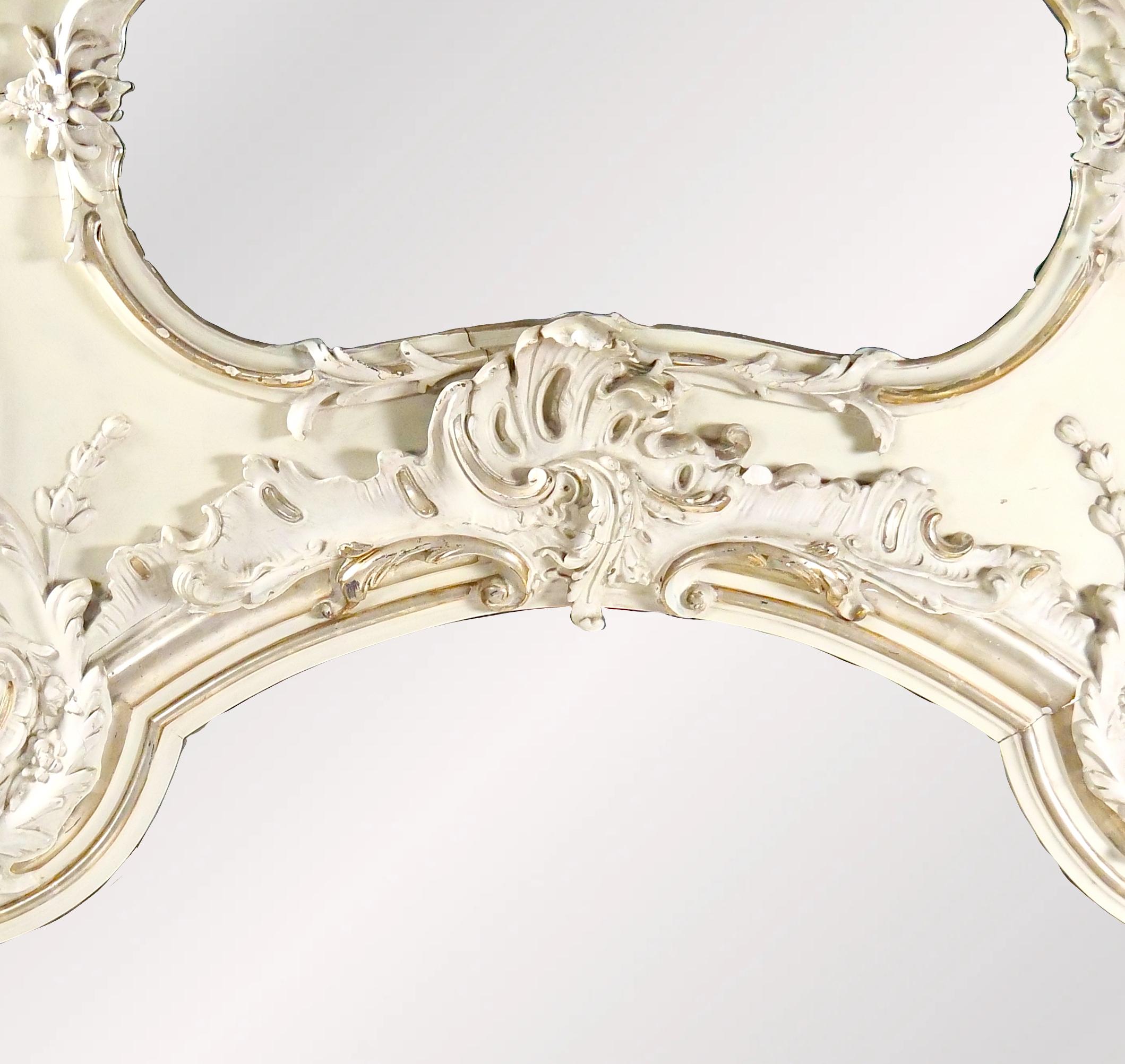Elevate your living space with this Very Large Trumeau Overmantel or Pier Mirror, a stunning piece of decor designed in the French Louis XV style. This mirror is not just a reflective surface; it is a work of art, meticulously crafted with exquisite