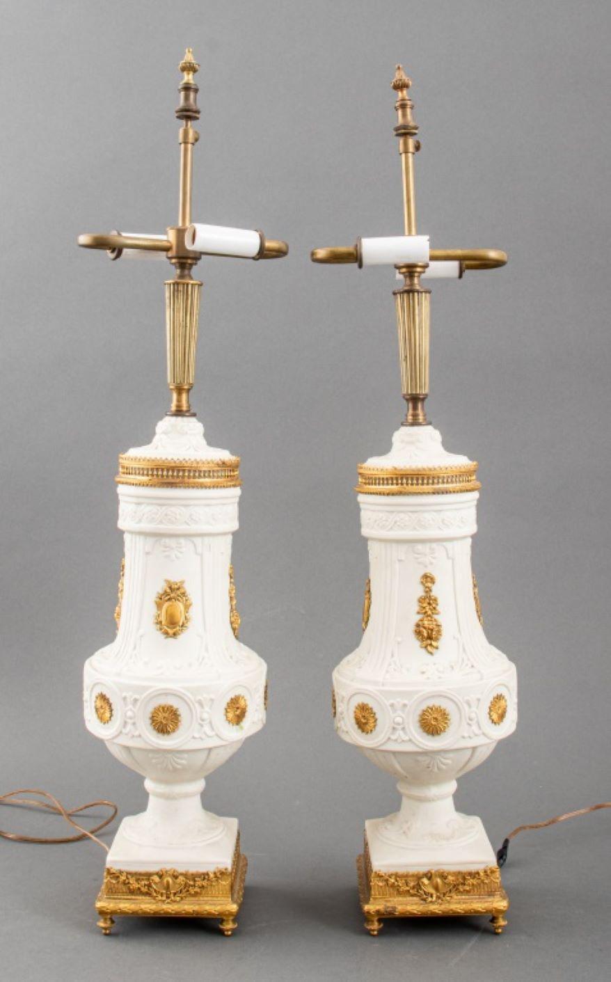 Pair of Louis XVI Style Parian and Gilt Metal Mounted Table Lamps, with impressed model numbers 