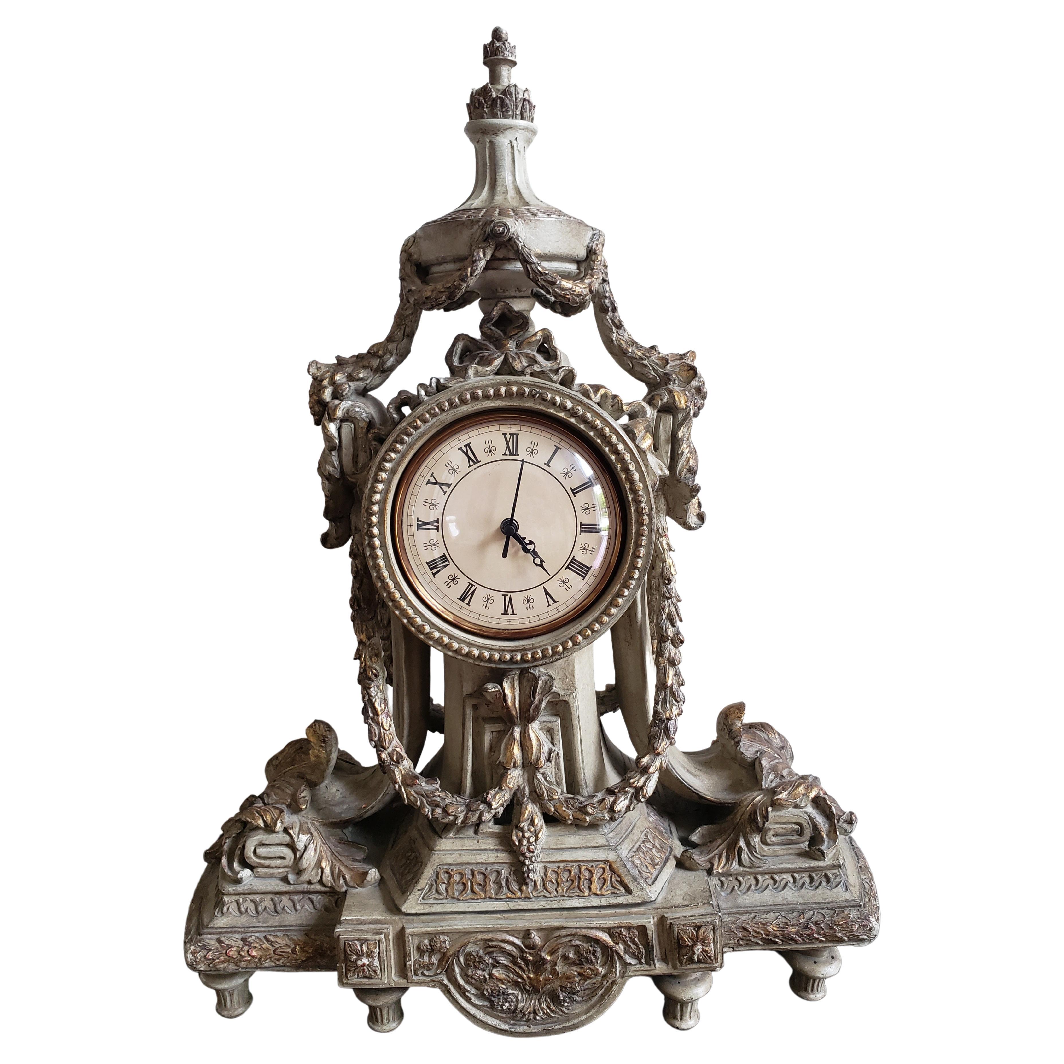 Louis XVI Style Partial Gilt and decorated Mantle Clock. True to the decorative arts of the 19 th century, this quality designer statement work blends style and function as it glows in the rich palette of the ancient world. 
Measures 17.5
